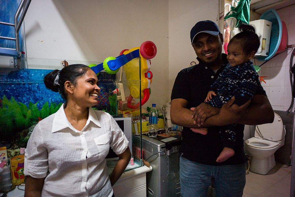 Supun, Nadeeka and one of their children.