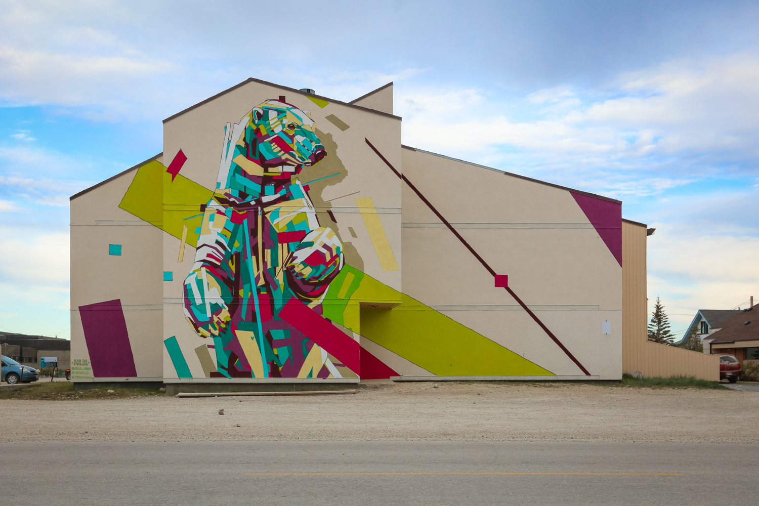 Rainbow Animals Roar Across Geometric Street Art Murals