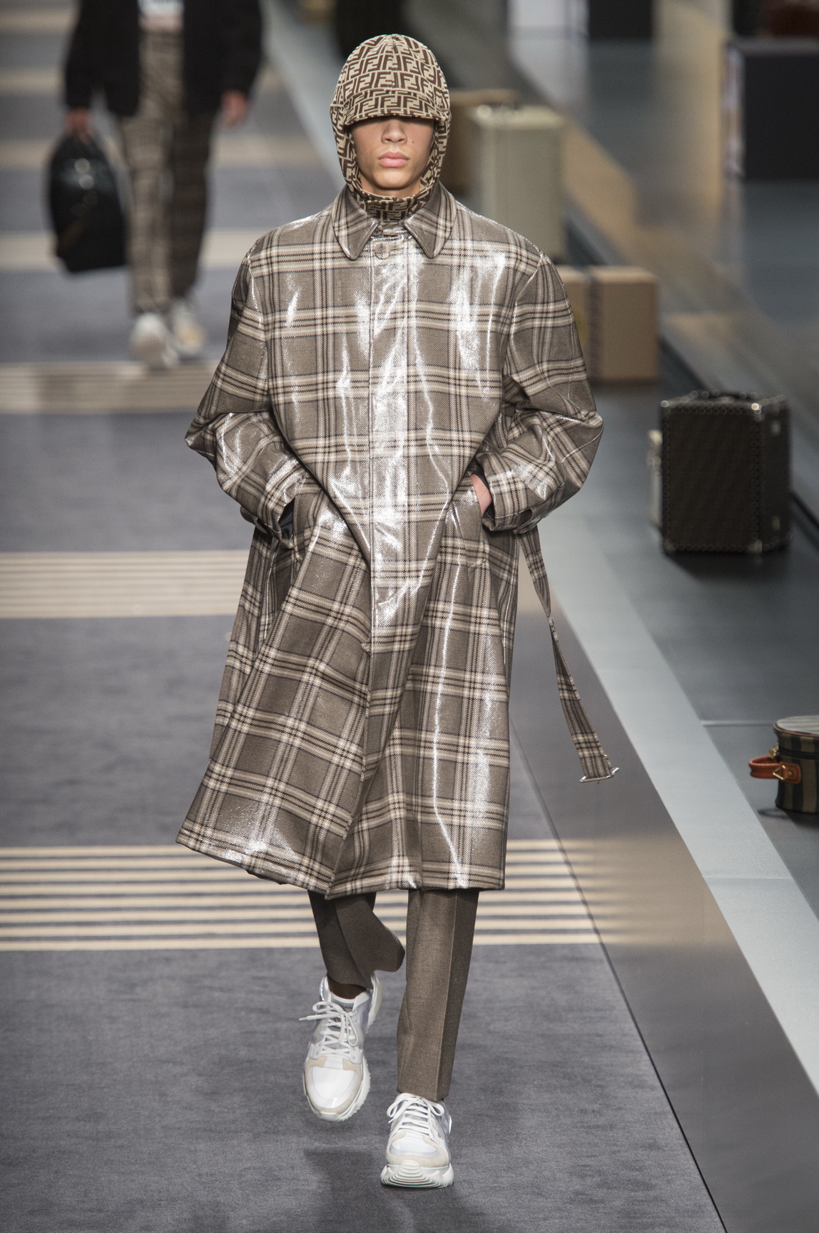 fendi actually showed umbrella hats on the runway at milan fashion 