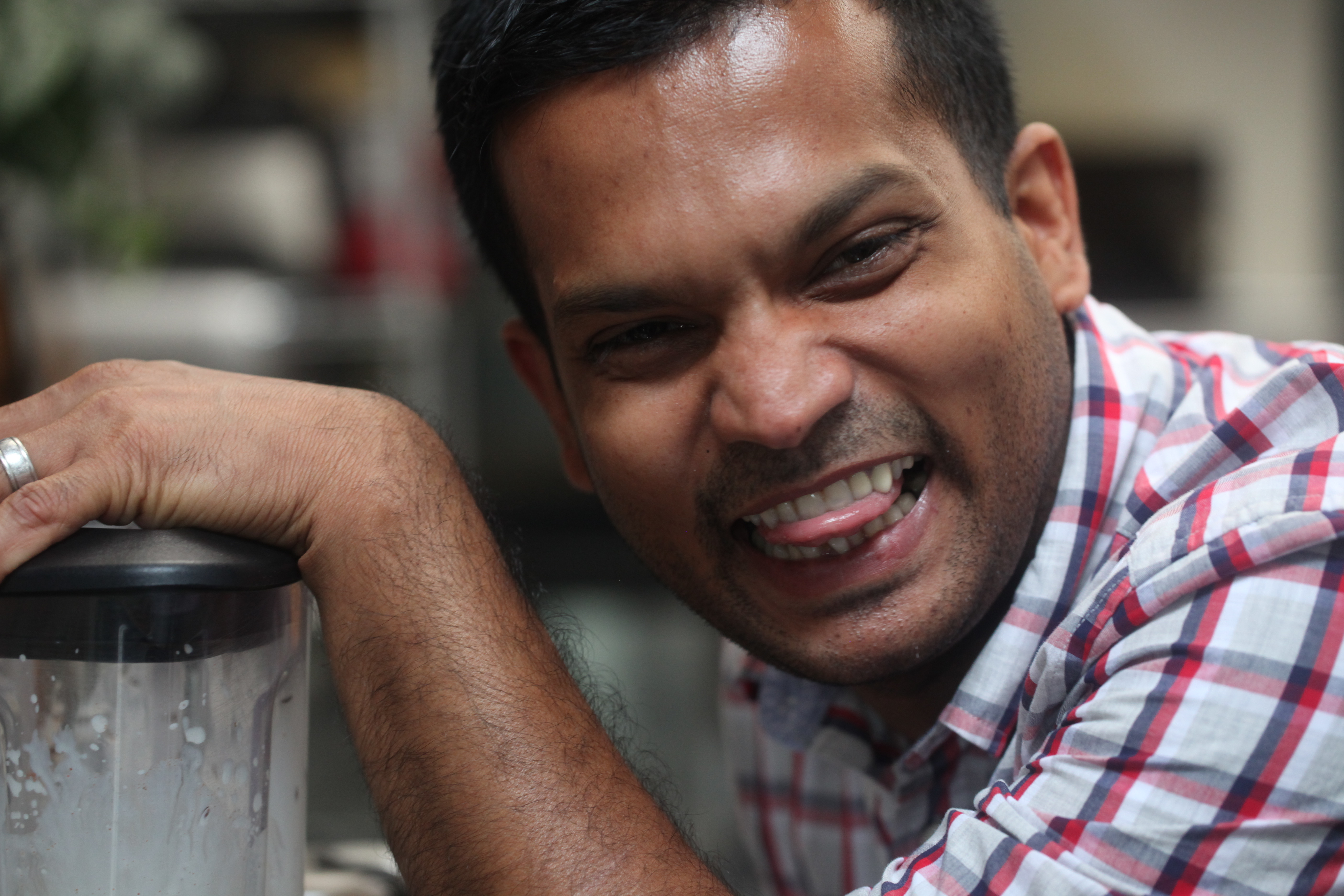 Man smirking with a blender