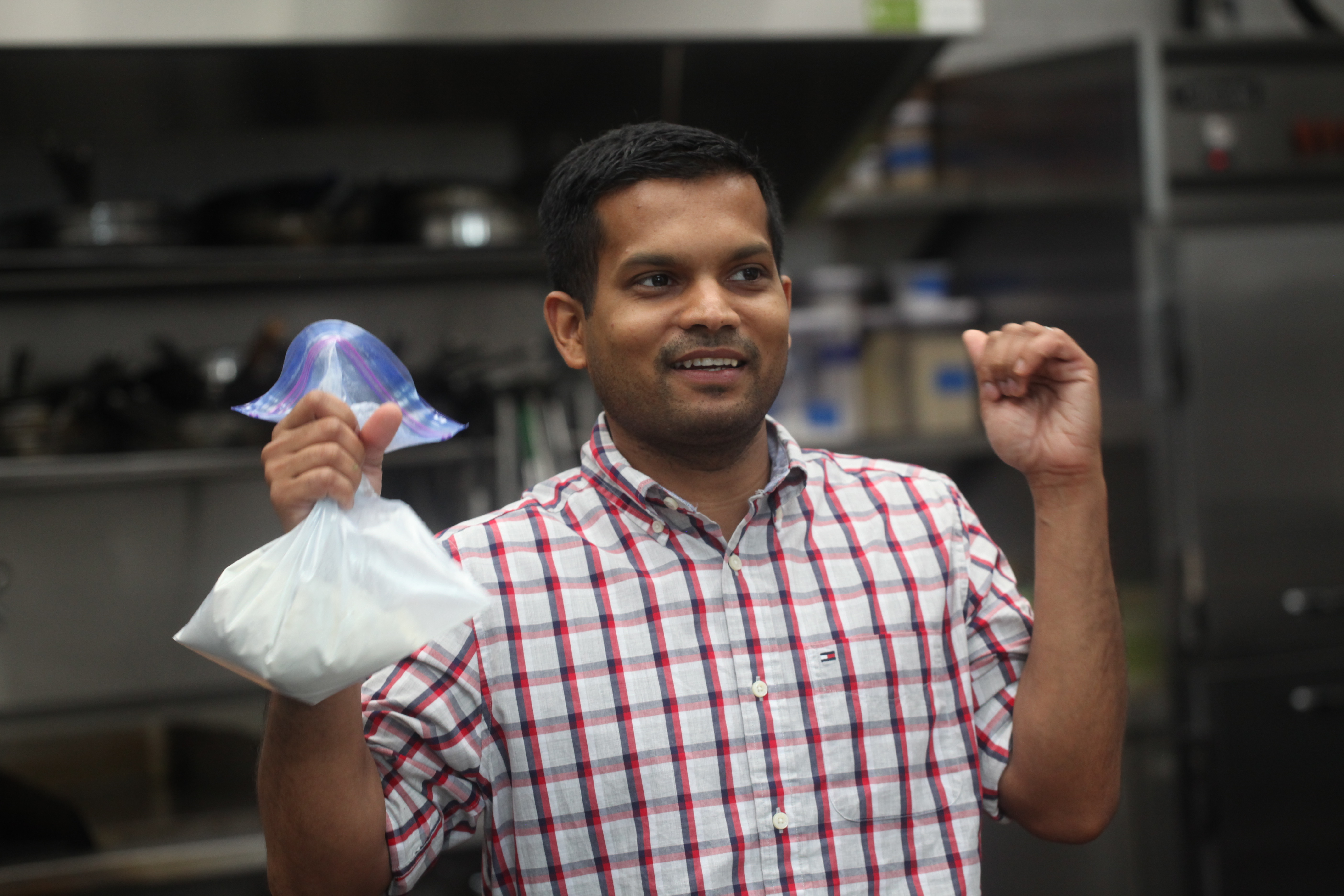 Man shaking a bag of chicken