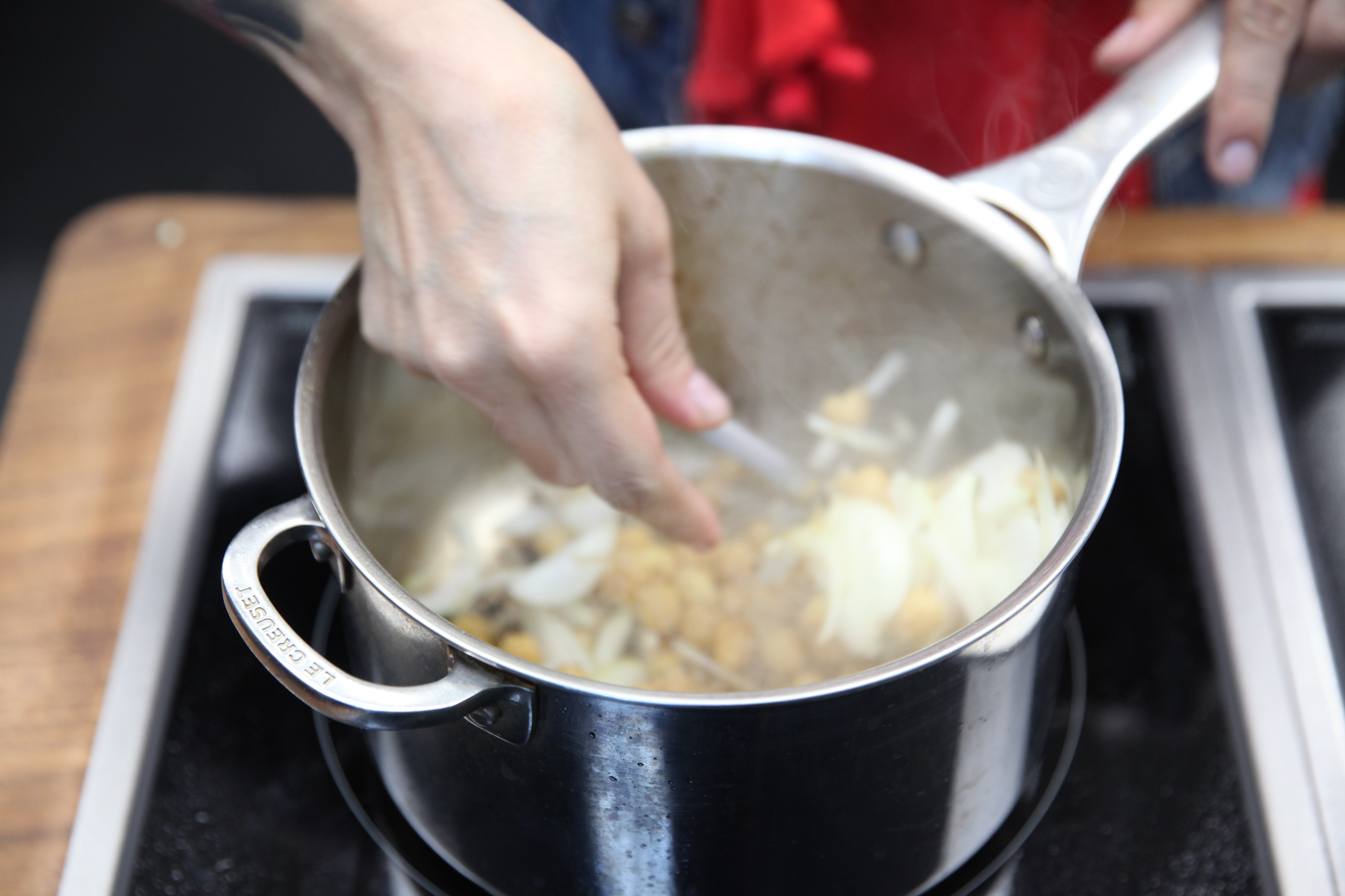 Chickpeas, shallots, garlic in saucepot