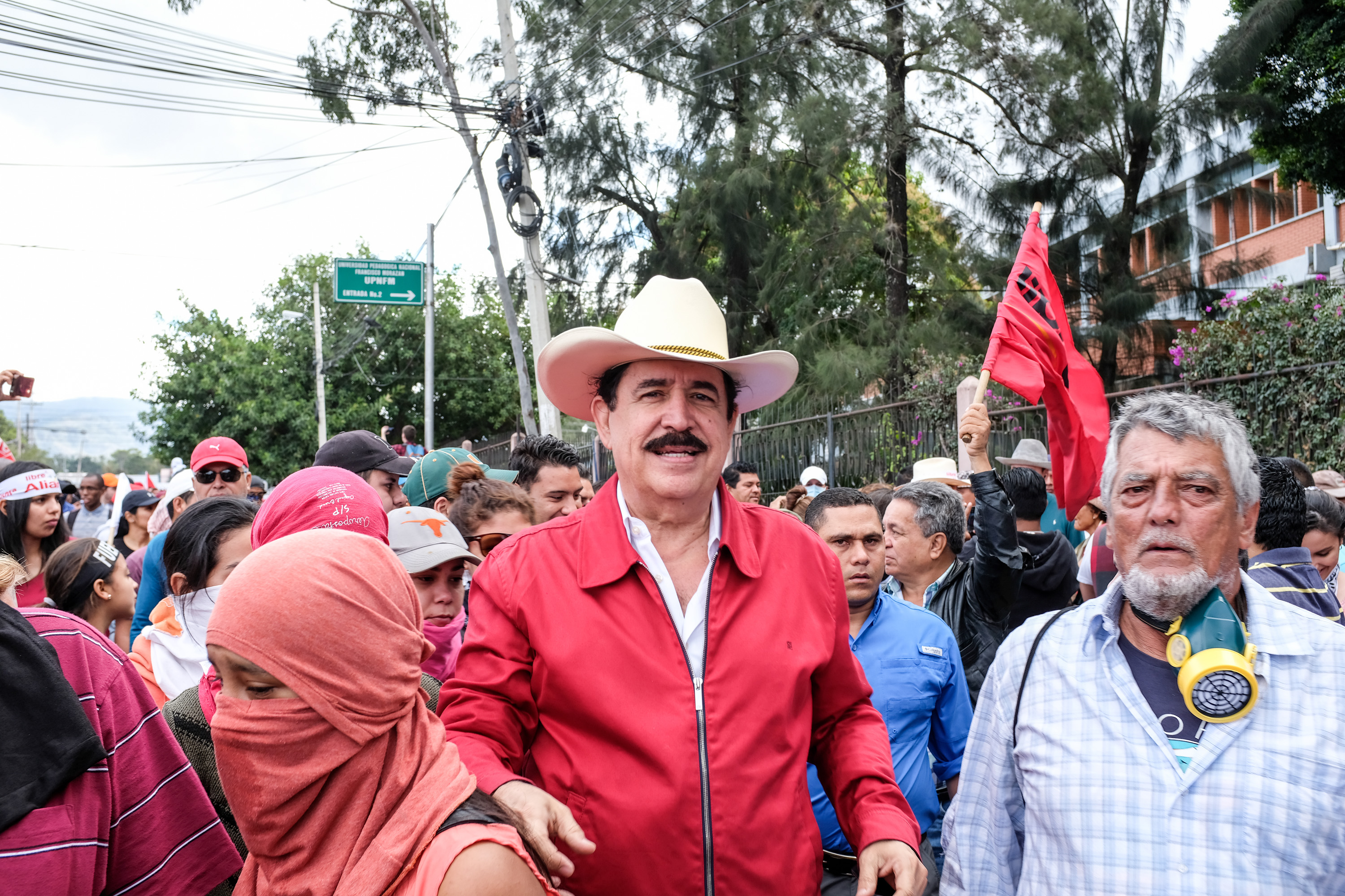 Manuel Zelaya surrounded by his supporters at a protest.