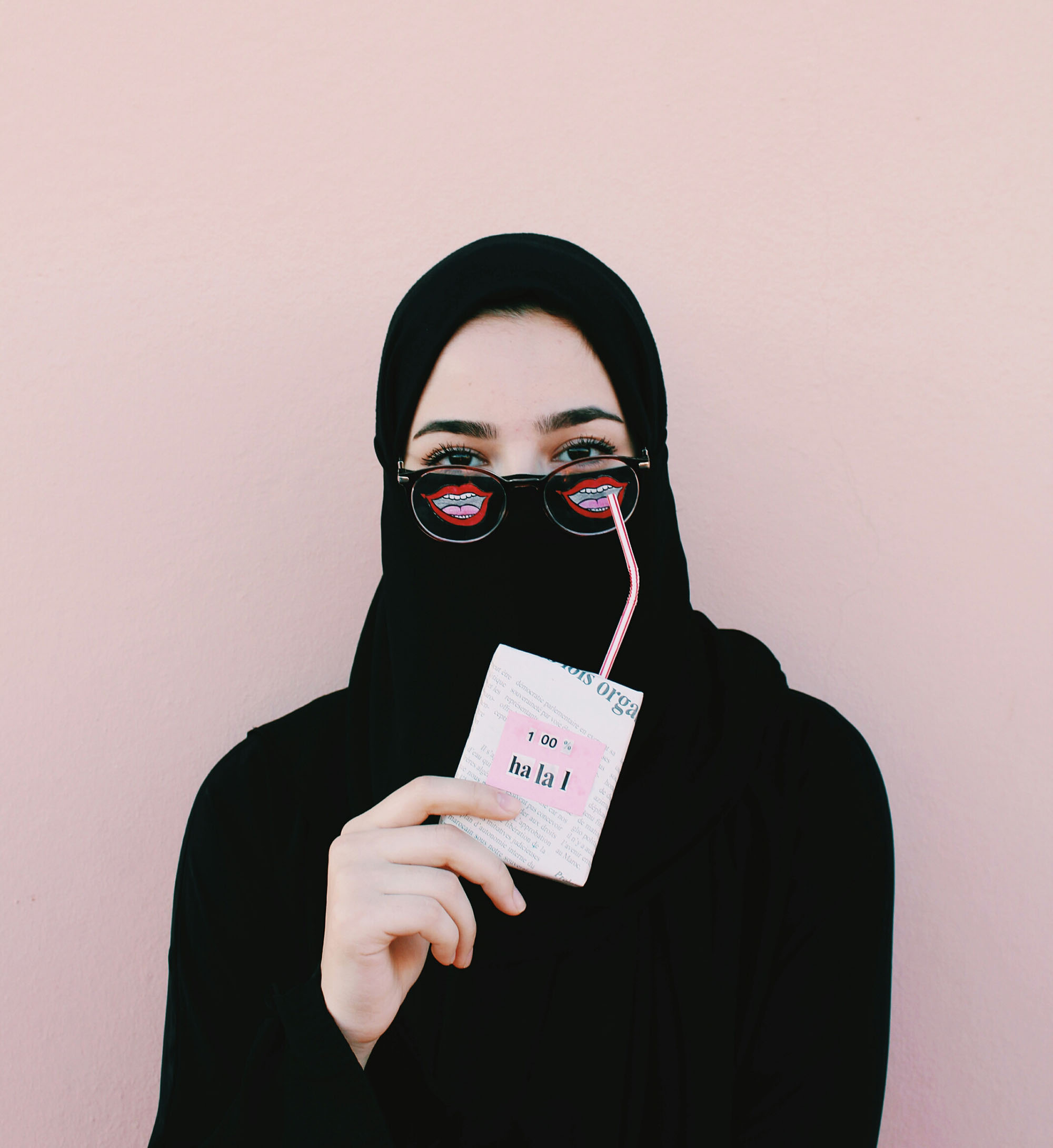 An Arab women drinking from juice.