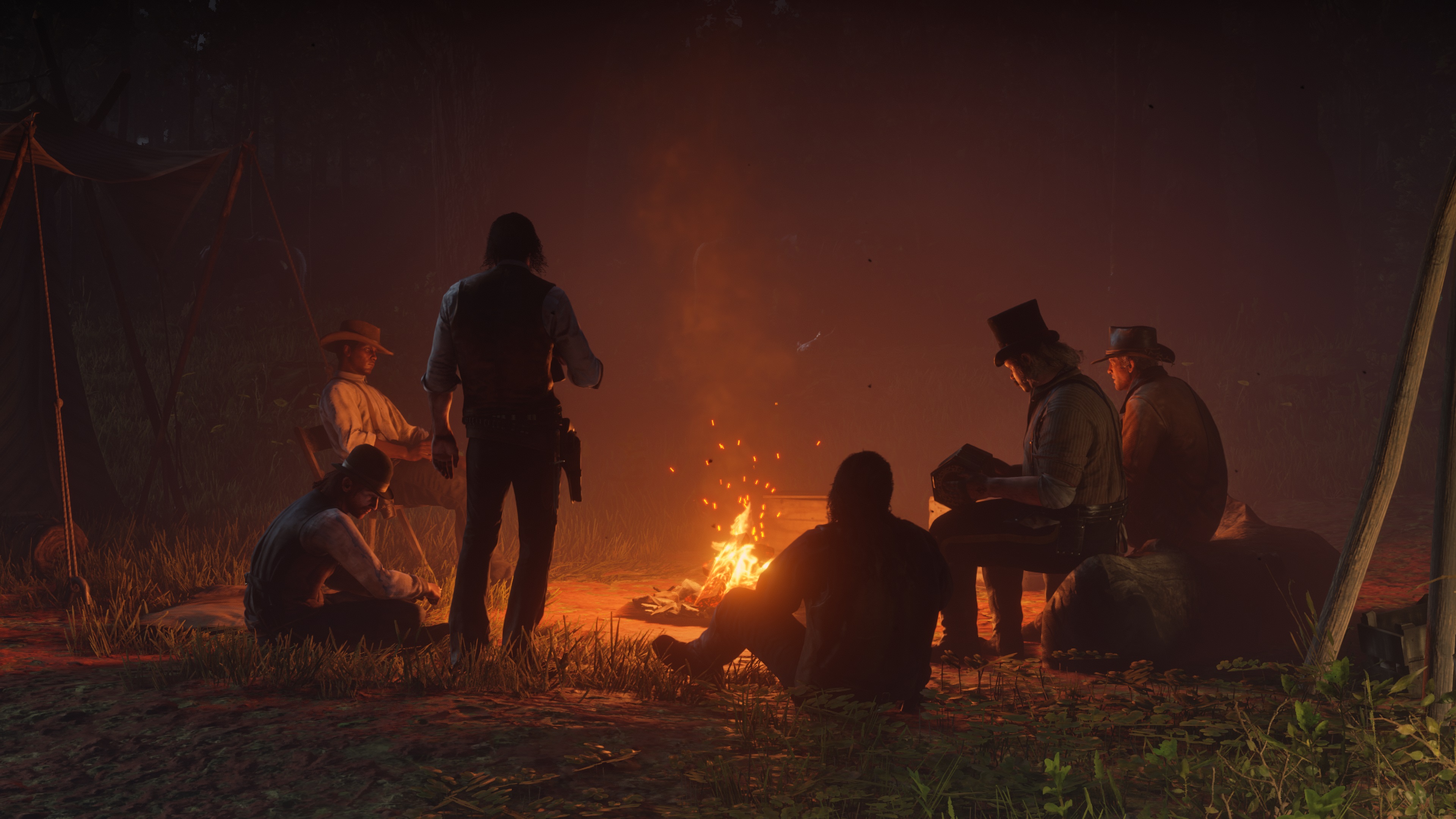 A gang out outlaws gathered around the warm orange glow of a campfire
