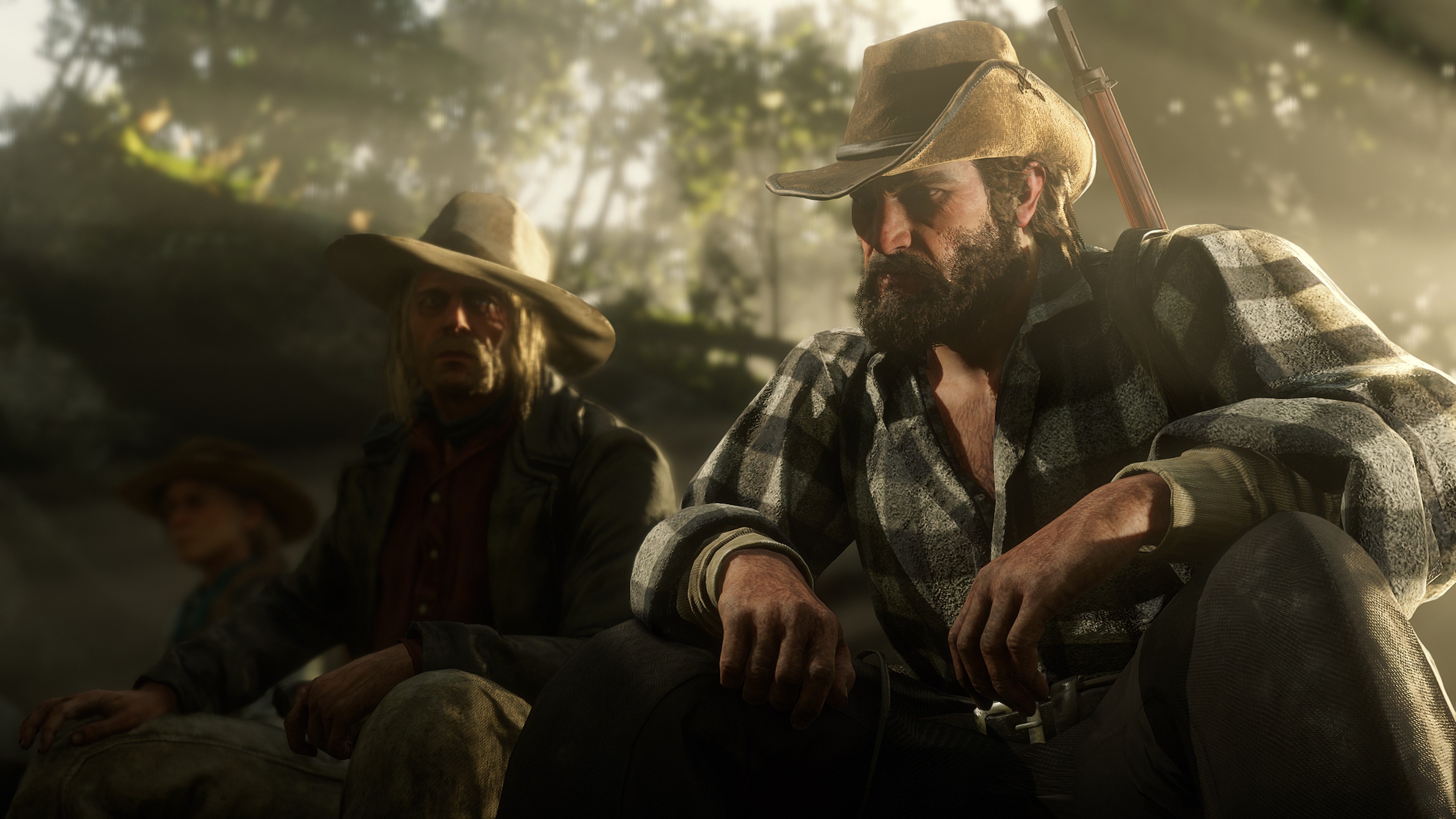 Two slovenly but undeniably weary and pitiable-looking cowboys sit side by side in reserved and awkward silence. The one nearest us stares unblinking into the middle distance while his companion regards him uncomfortably, torn between his own reticence and his desire to give voice to his sympathy and pain.