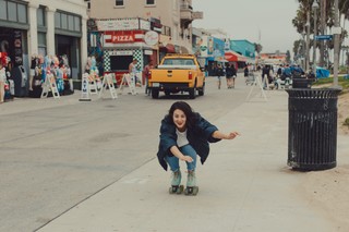 Me, bombing down the Venice Boardwalk