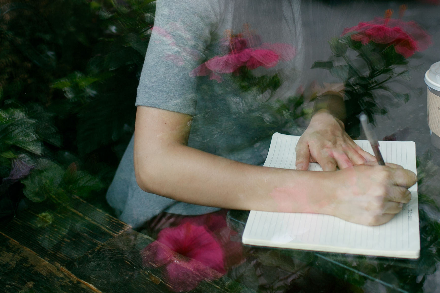 Woman writes in her notebook
