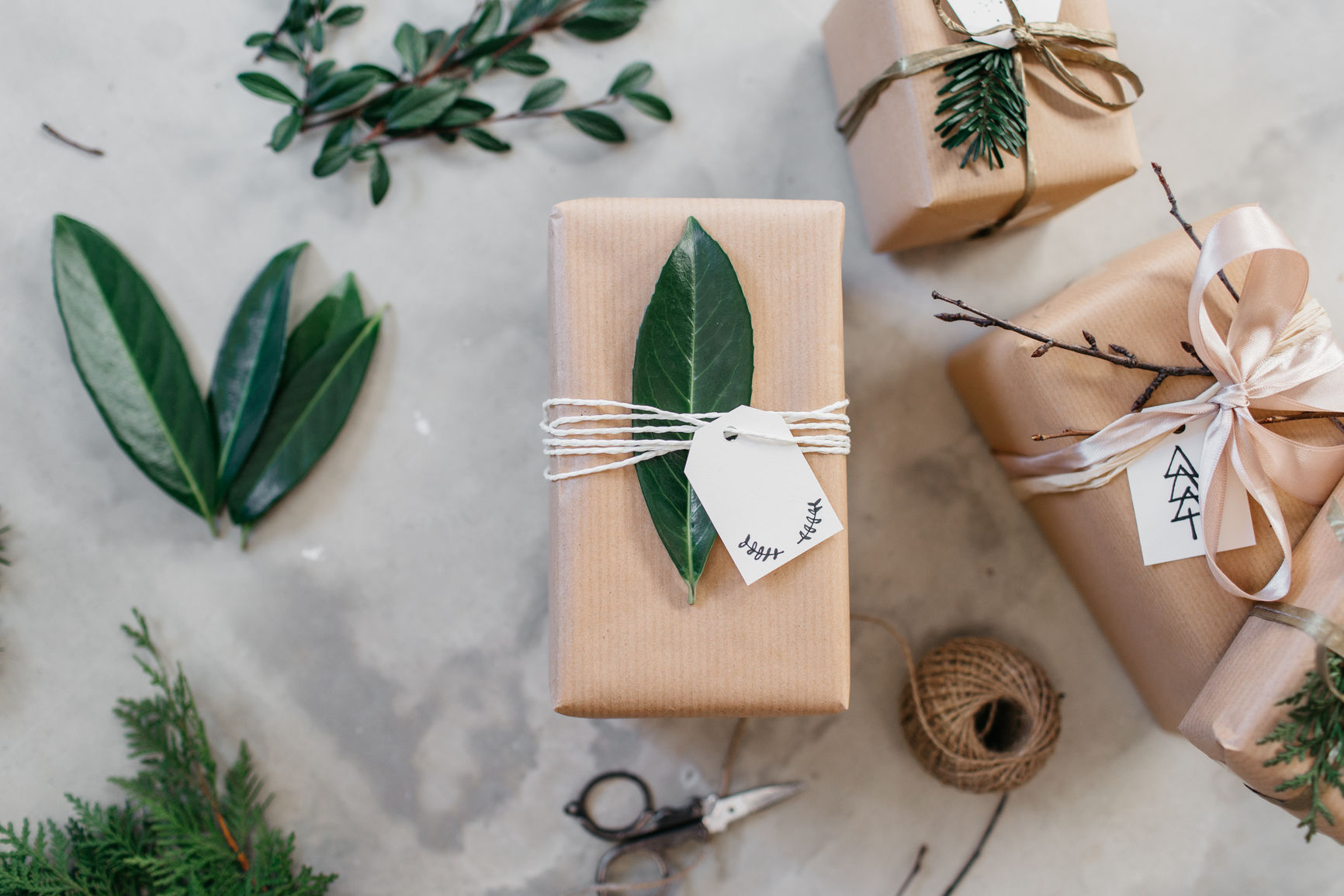 Top a gift with twine and a leaf or branch