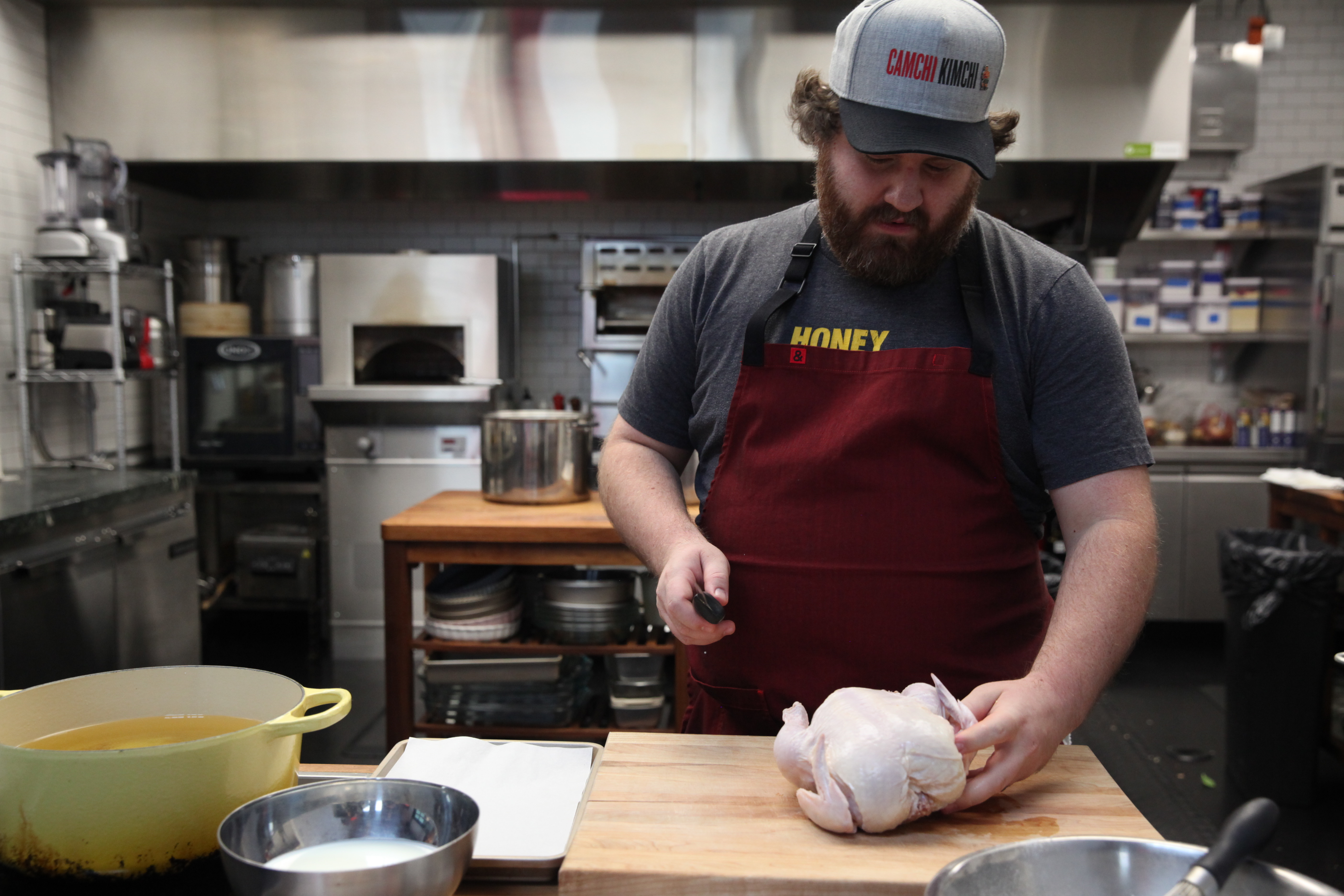 cam waron cutting a chicken