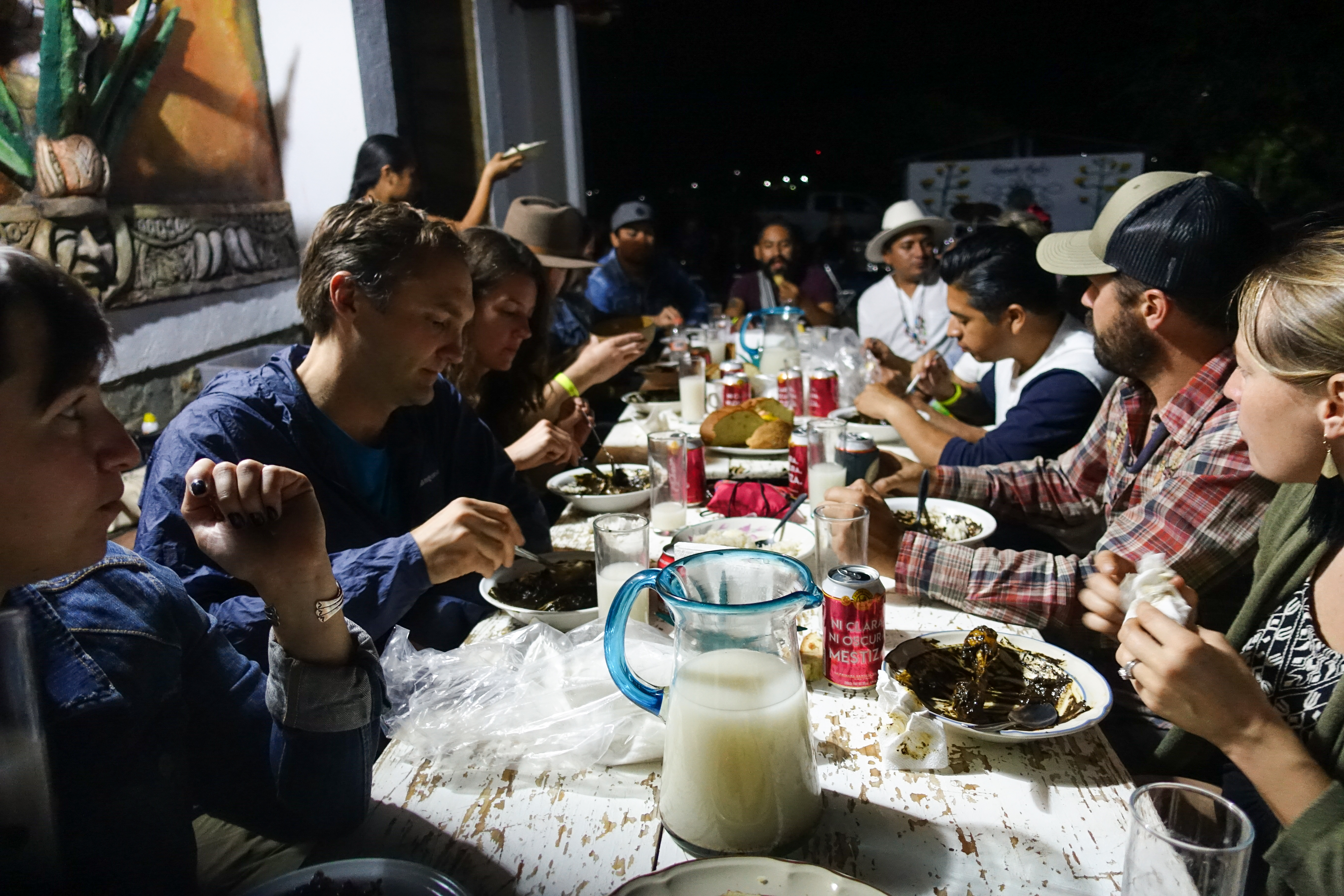 The group dines on mole, mezcal, and beer.