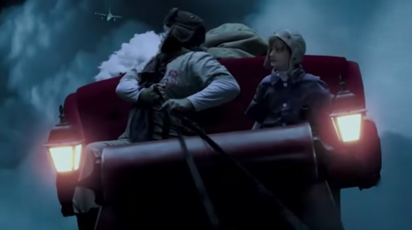 Santa, in his sleigh, being pursued by a fighter jet