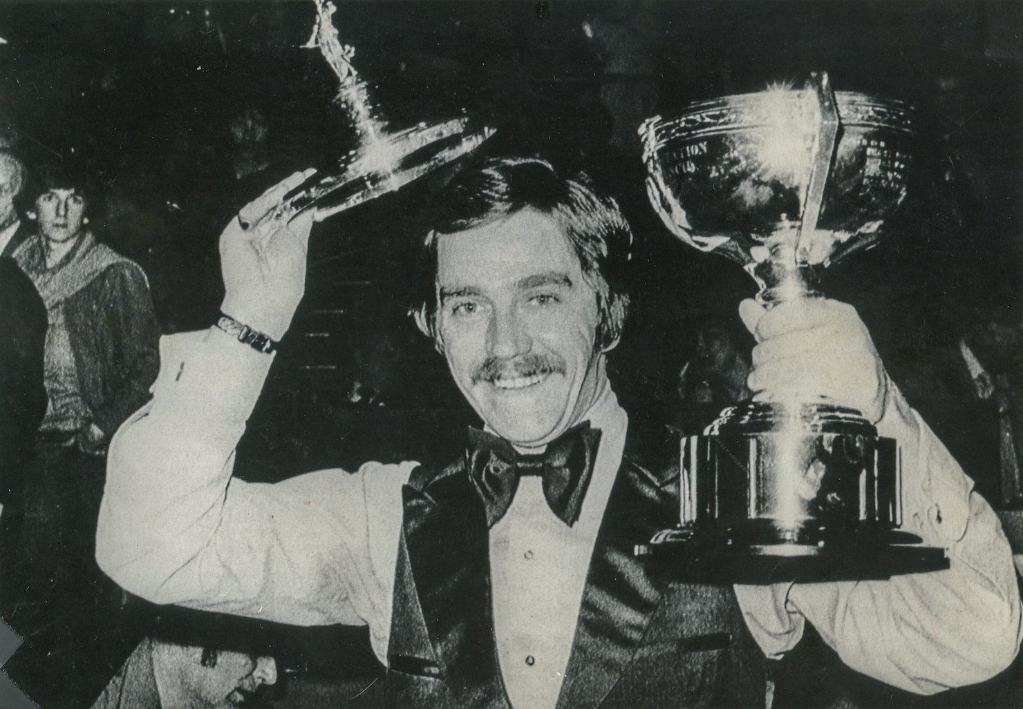 Cliff Thorburn celebrates after winning a snooker championship.