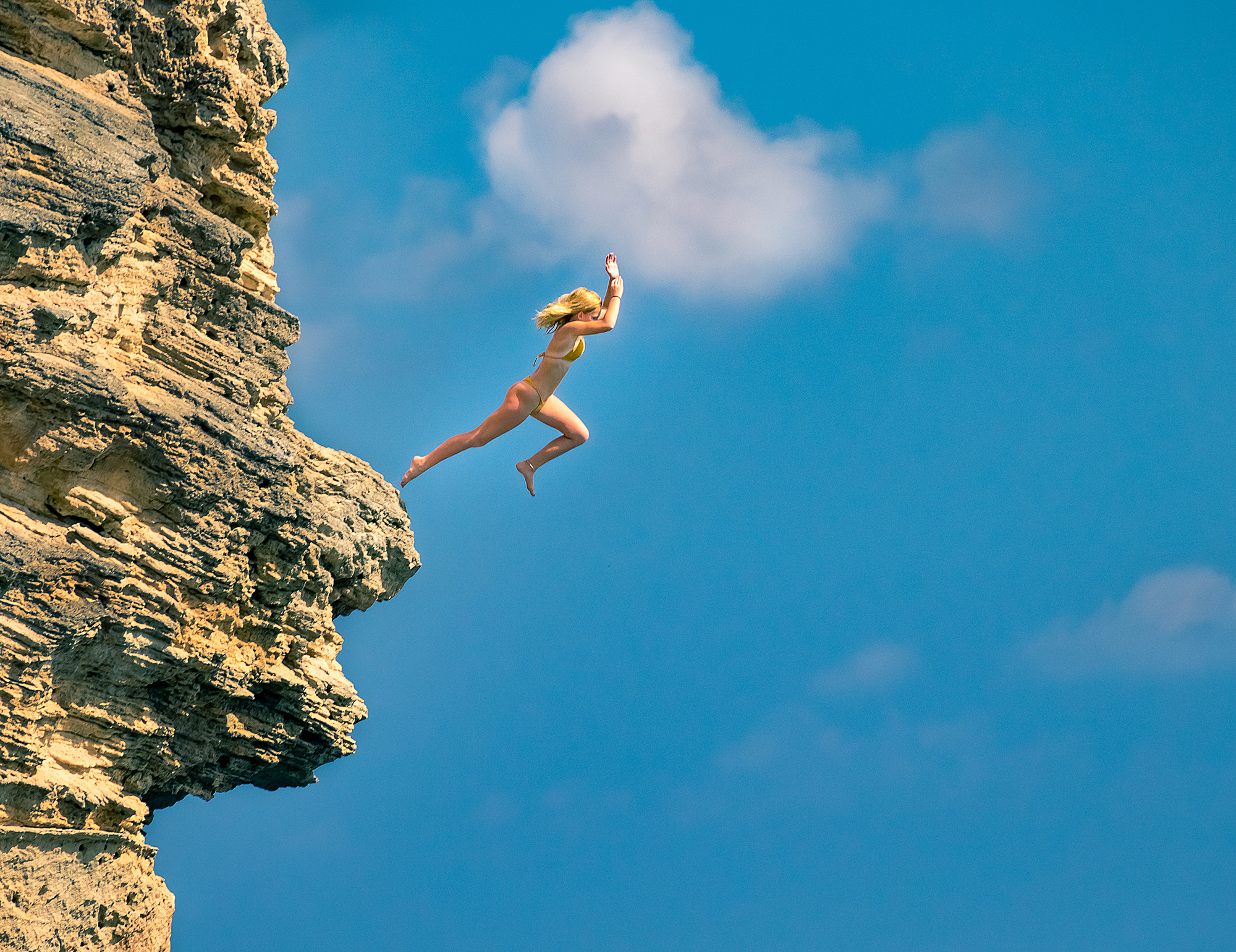 1545562905998-Girl-jumping-Kauai-Hawaii