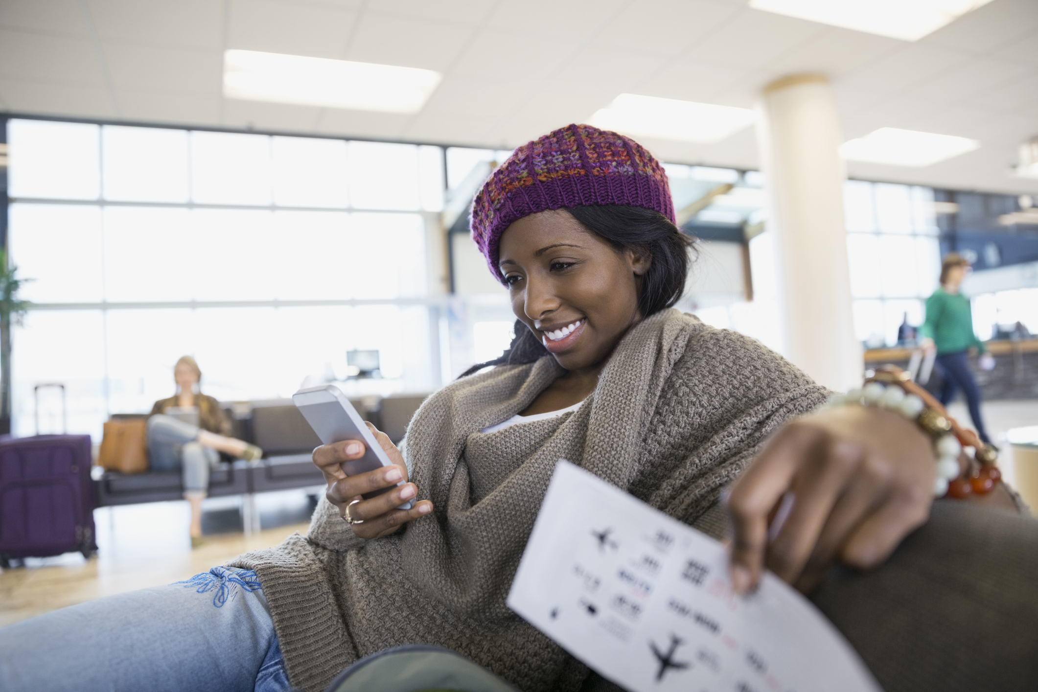 Woman waiting at airport. Photo by Getty Hero Images