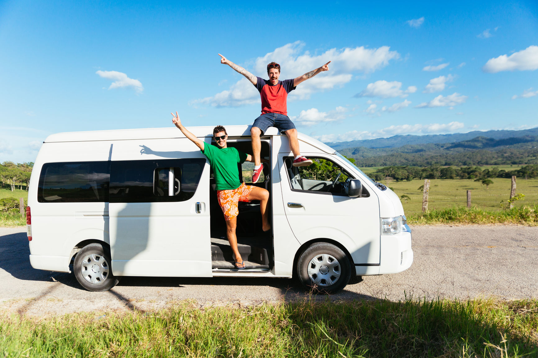 Guys on vacation in a van. Photo by Alejandro Moreno De Carlos Stocksy