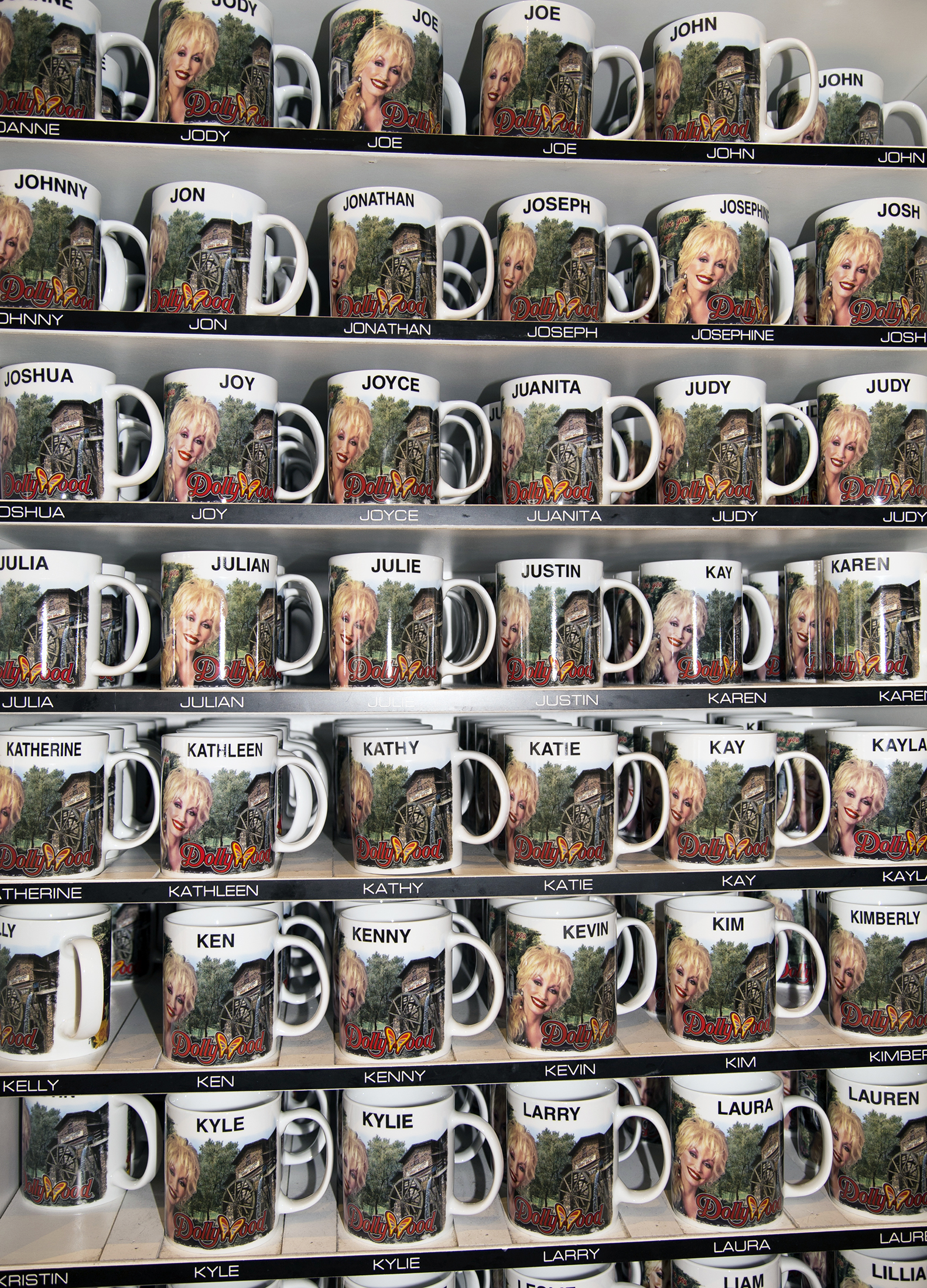 A rack of Dolly Parton-branded mugs