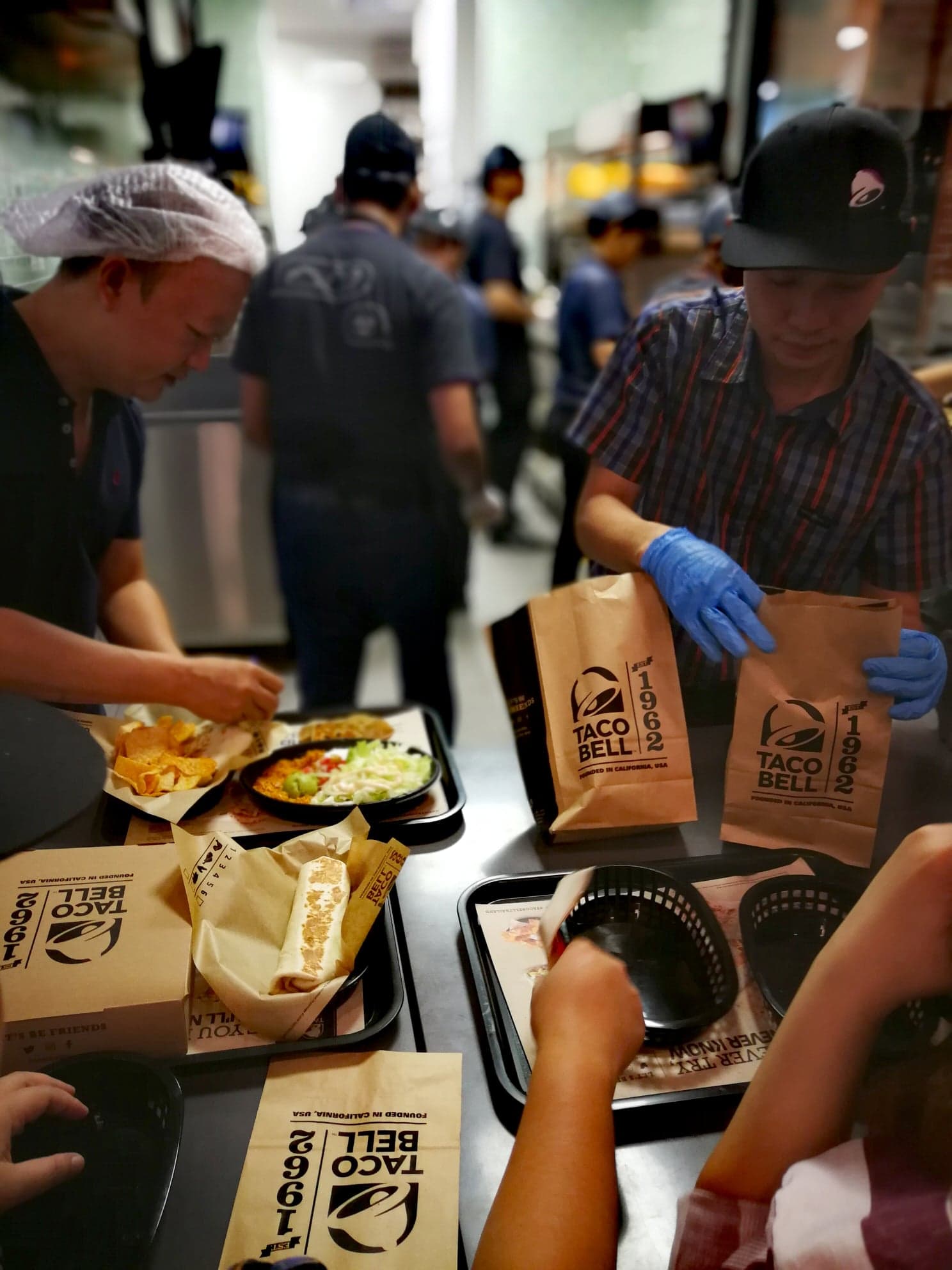 Workers preparing food at Taco Bell's new Thailand location in Bangkok