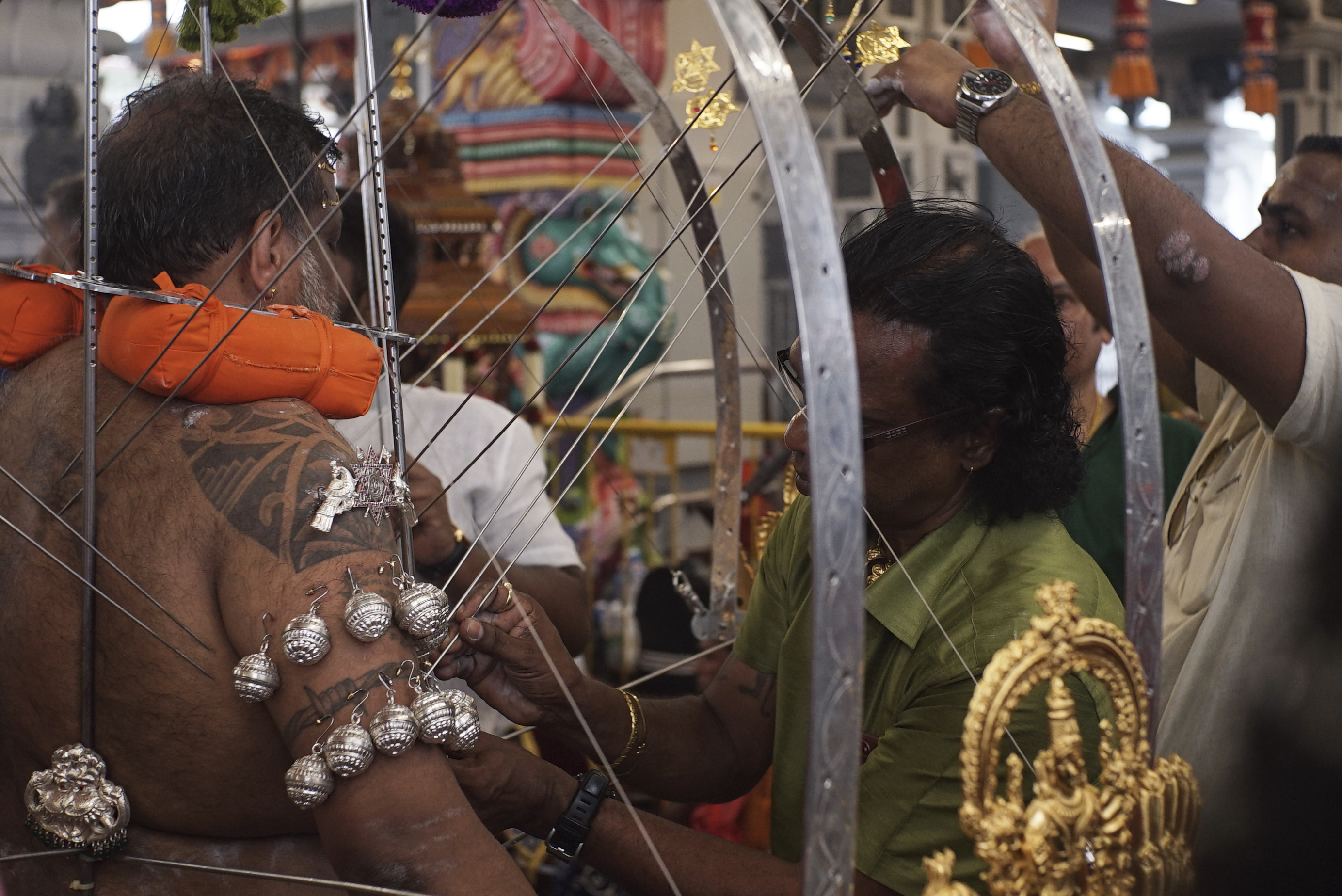 Thaipusam spike kavadi bearer piercing