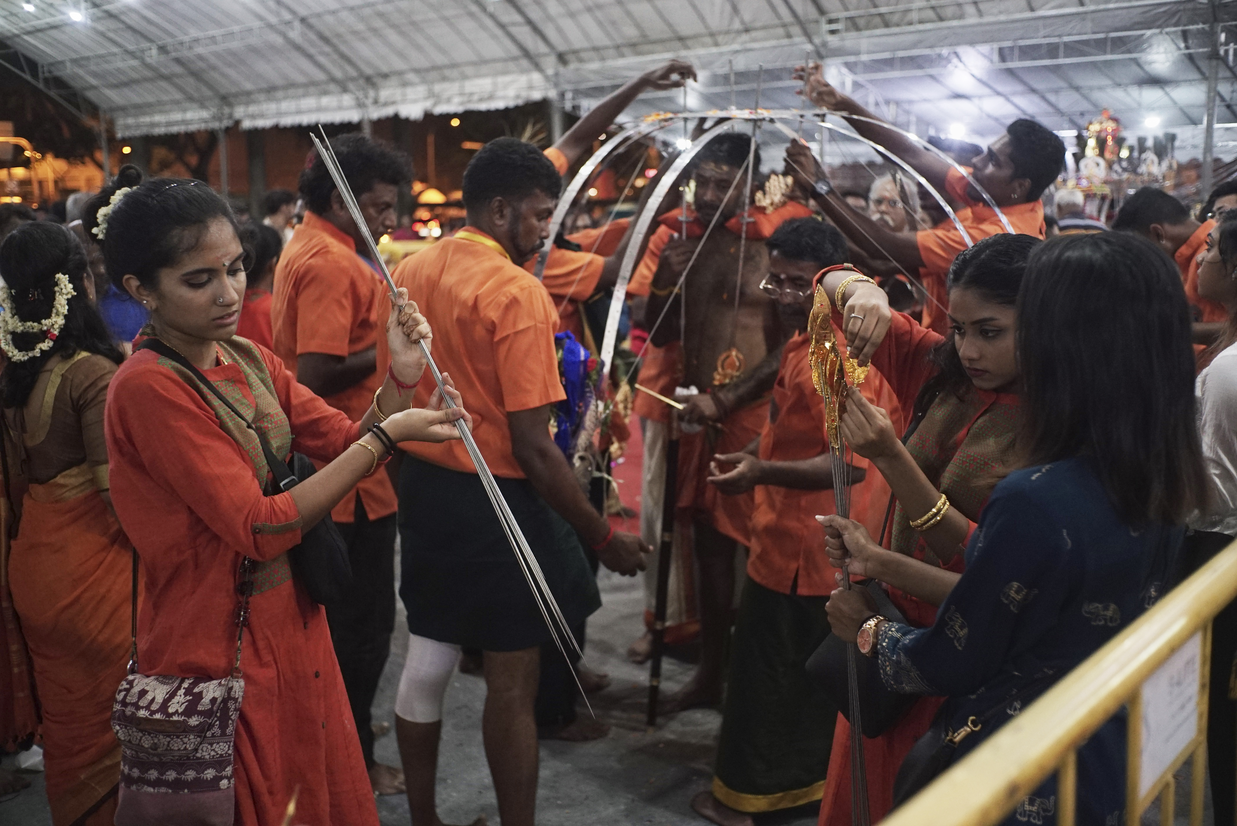 thaipusam family removing spikes