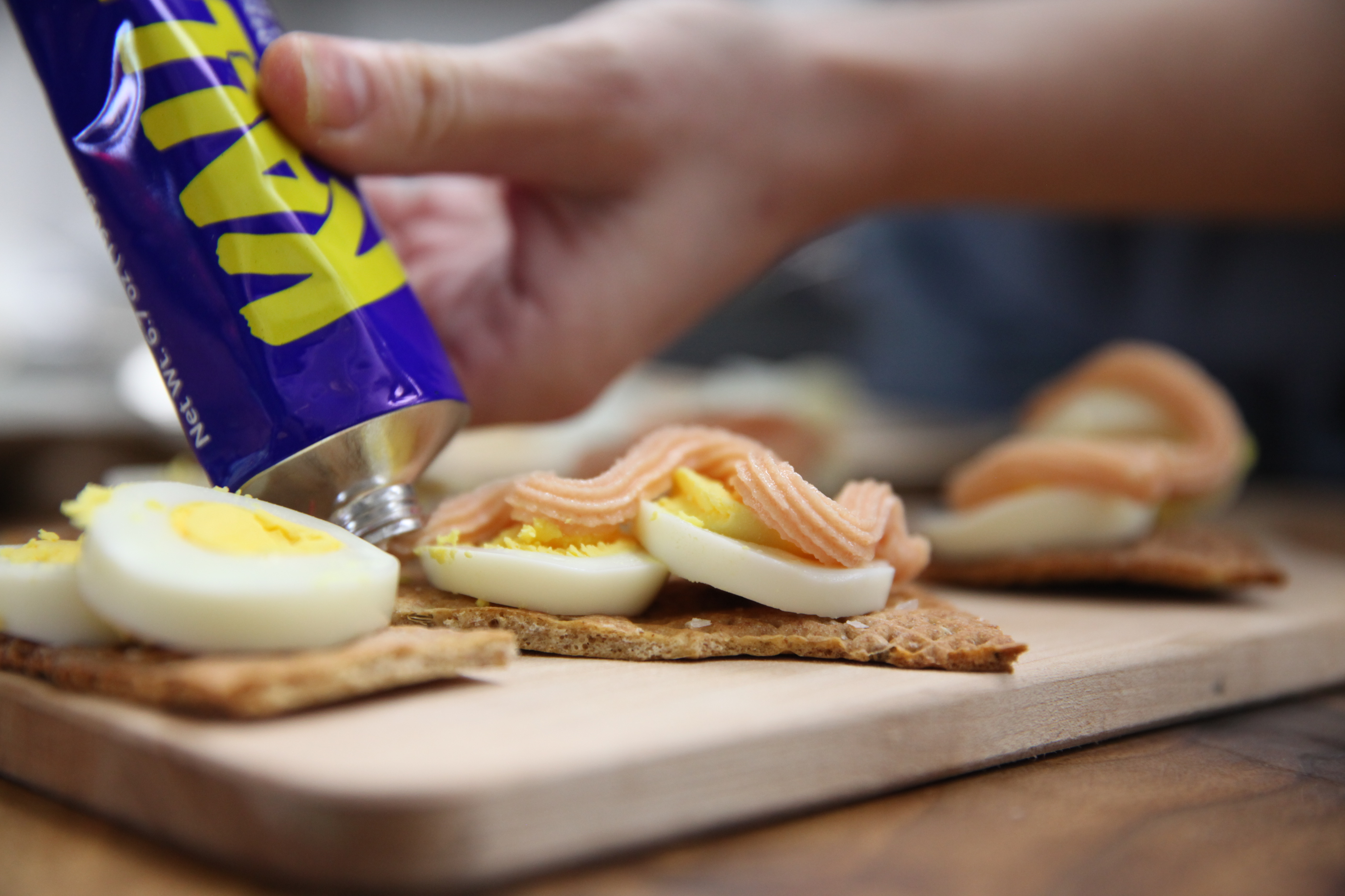 knackebrod topped with an egg and kalles spread