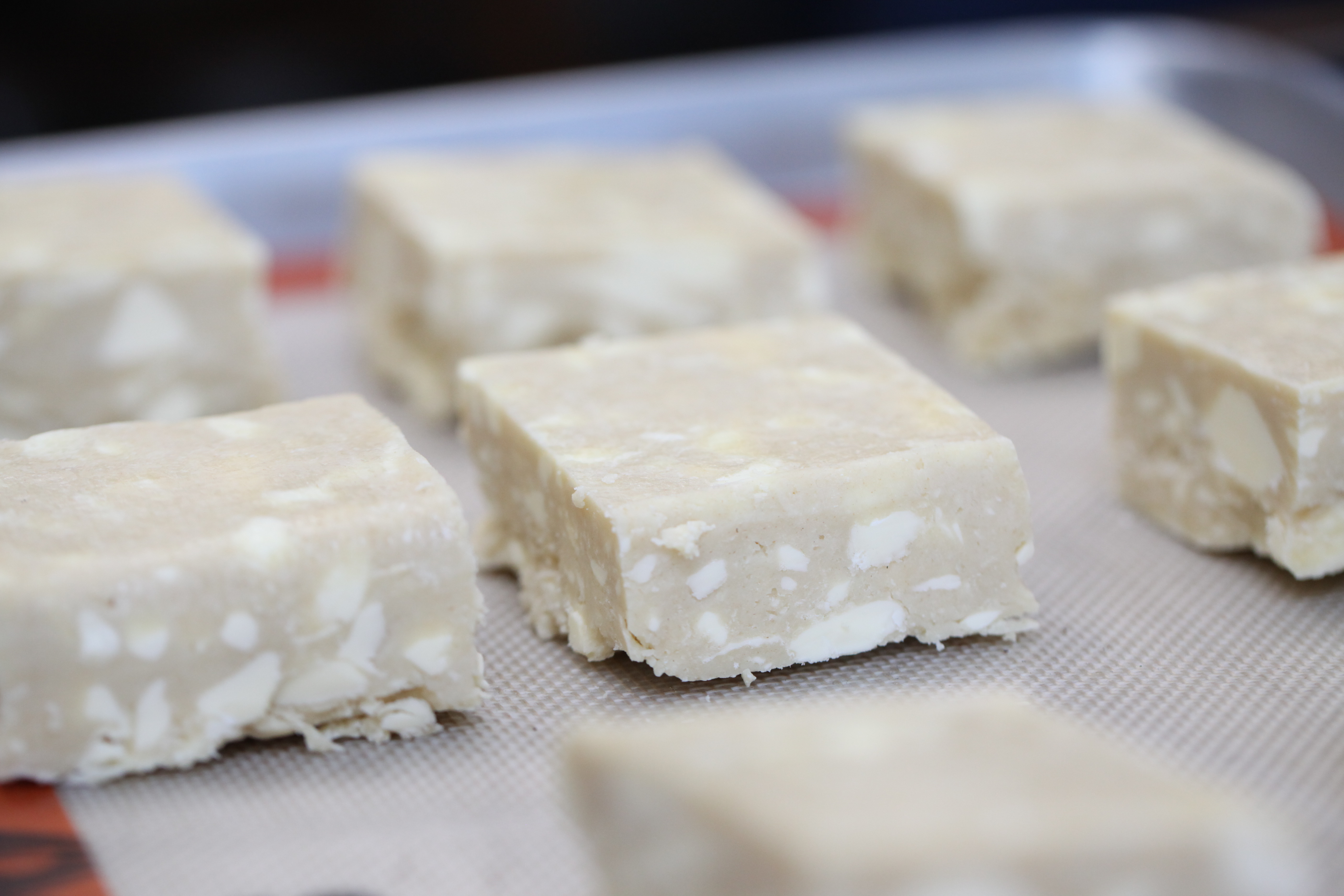 sunday in brooklyn's biscuits cut and ready to bake on a lined baking sheet