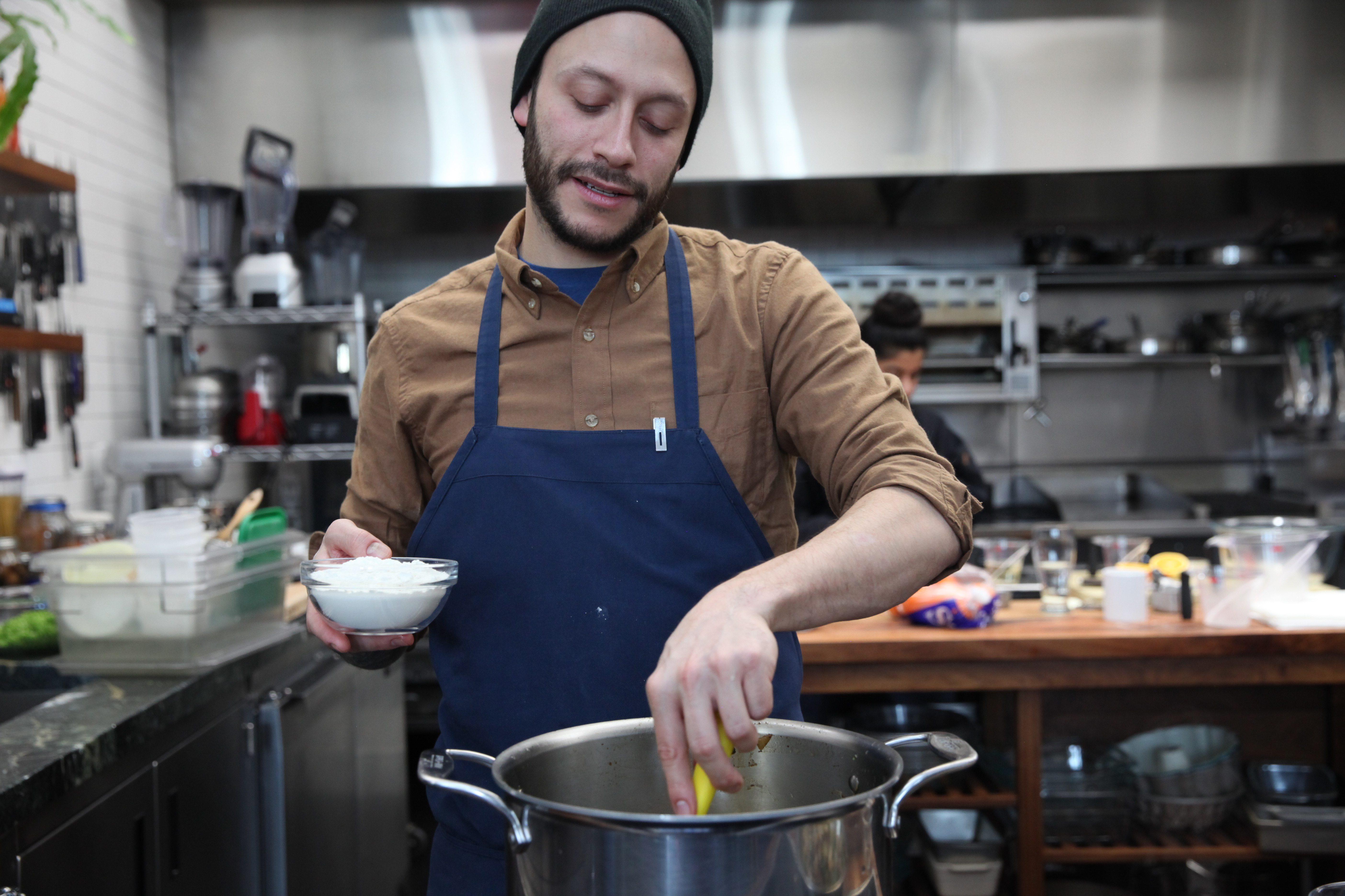 chef jaime young of sunday in brooklyn making sausage gravy