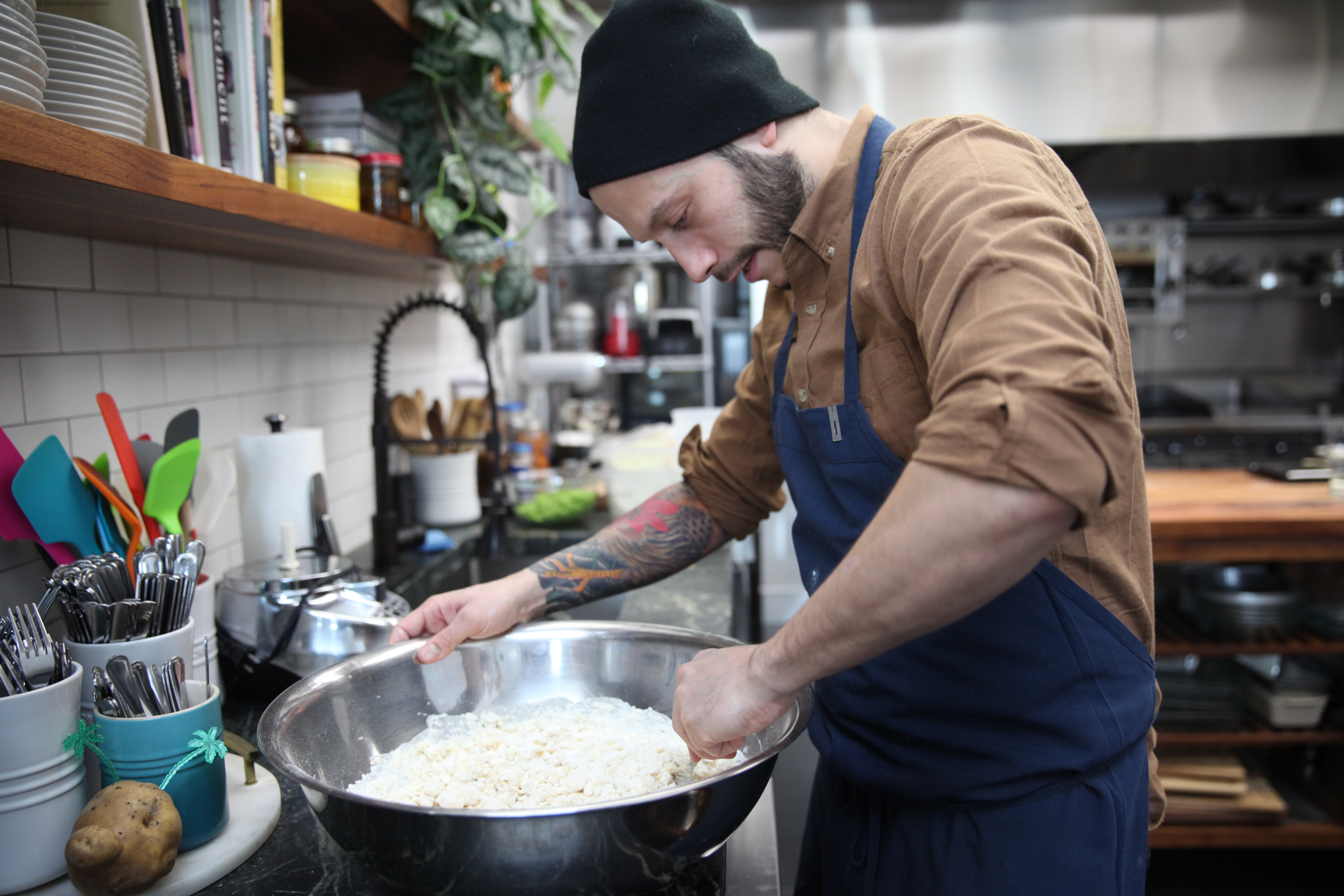 chef jaime young of sunday in brooklyn mixing dough for biscuits