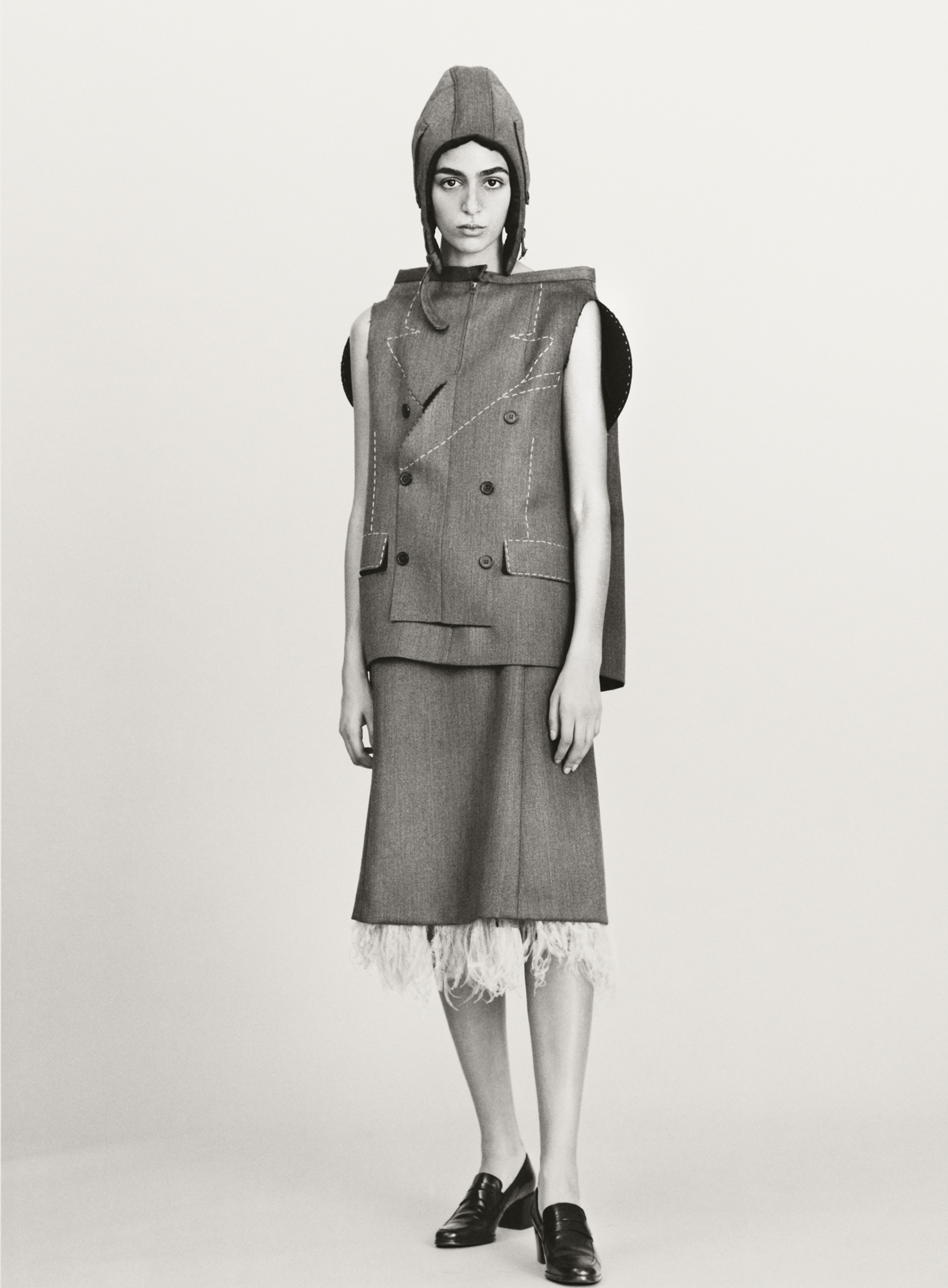 Hat, vest, and skirt by MAISON MARGIELA, loafers by HORIZONS VINTAGE.