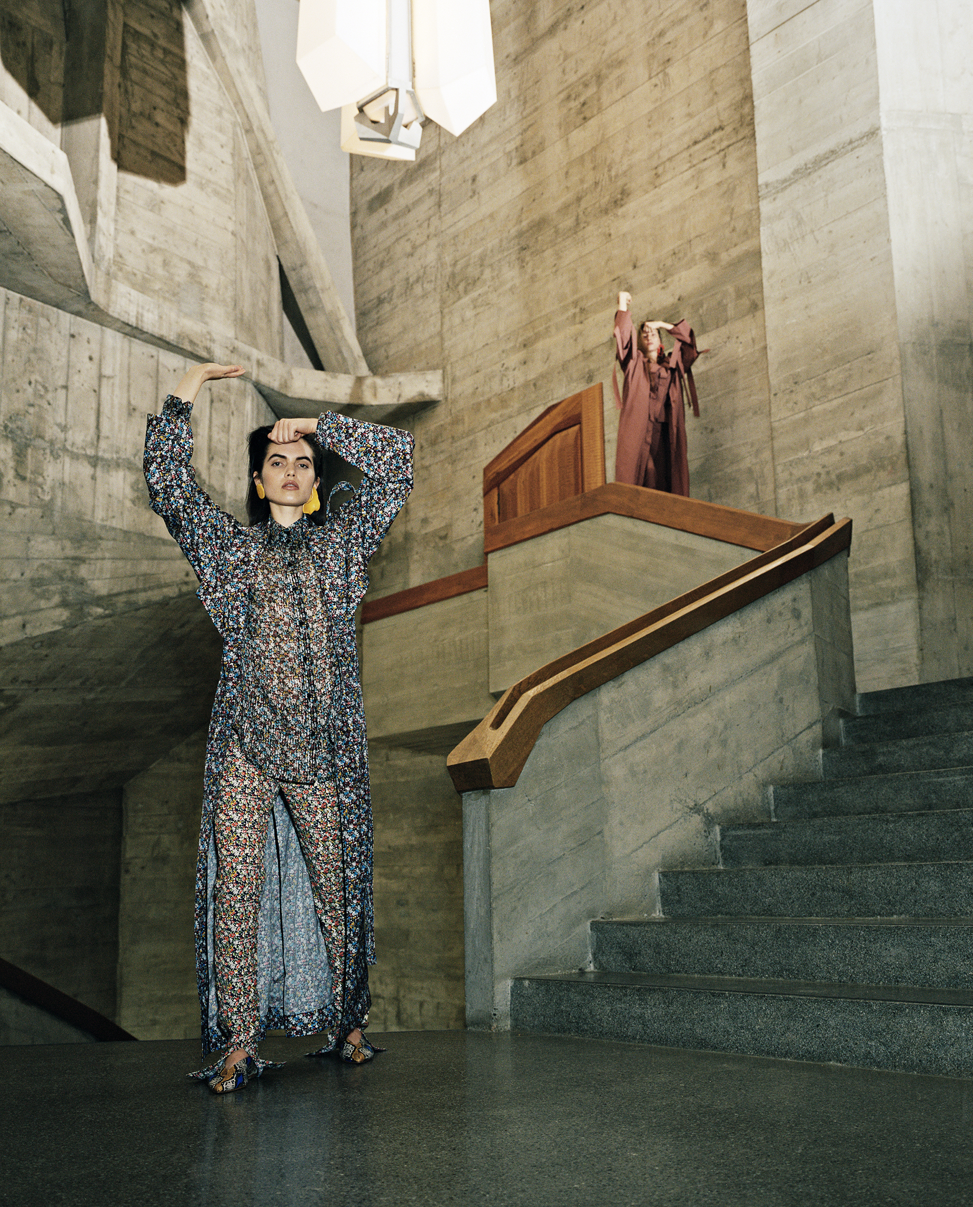 Lily wears blouse, jacket, and trousers by VICTORIA BECKHAM, earrings by ZARVICH, shoes by AEYDE.