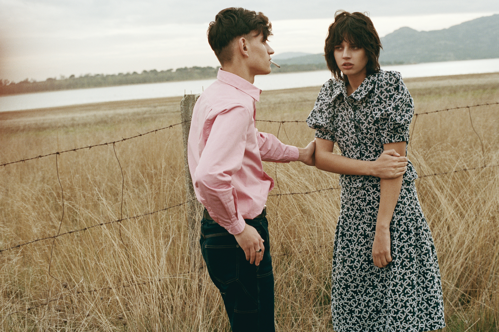Cristian Vitos (left) wears BALENCIAGA, Yasmina Paiman (right) wears top and skirt by CHANEL.