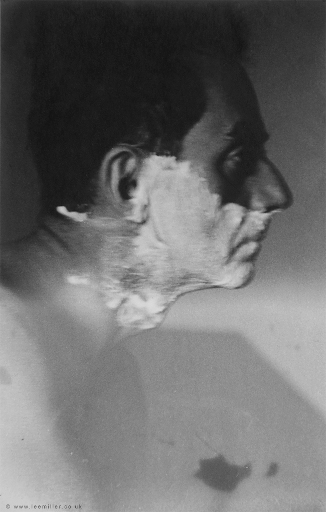 1551958540249-Man_Ray_Shaving_by_Lee_Miller