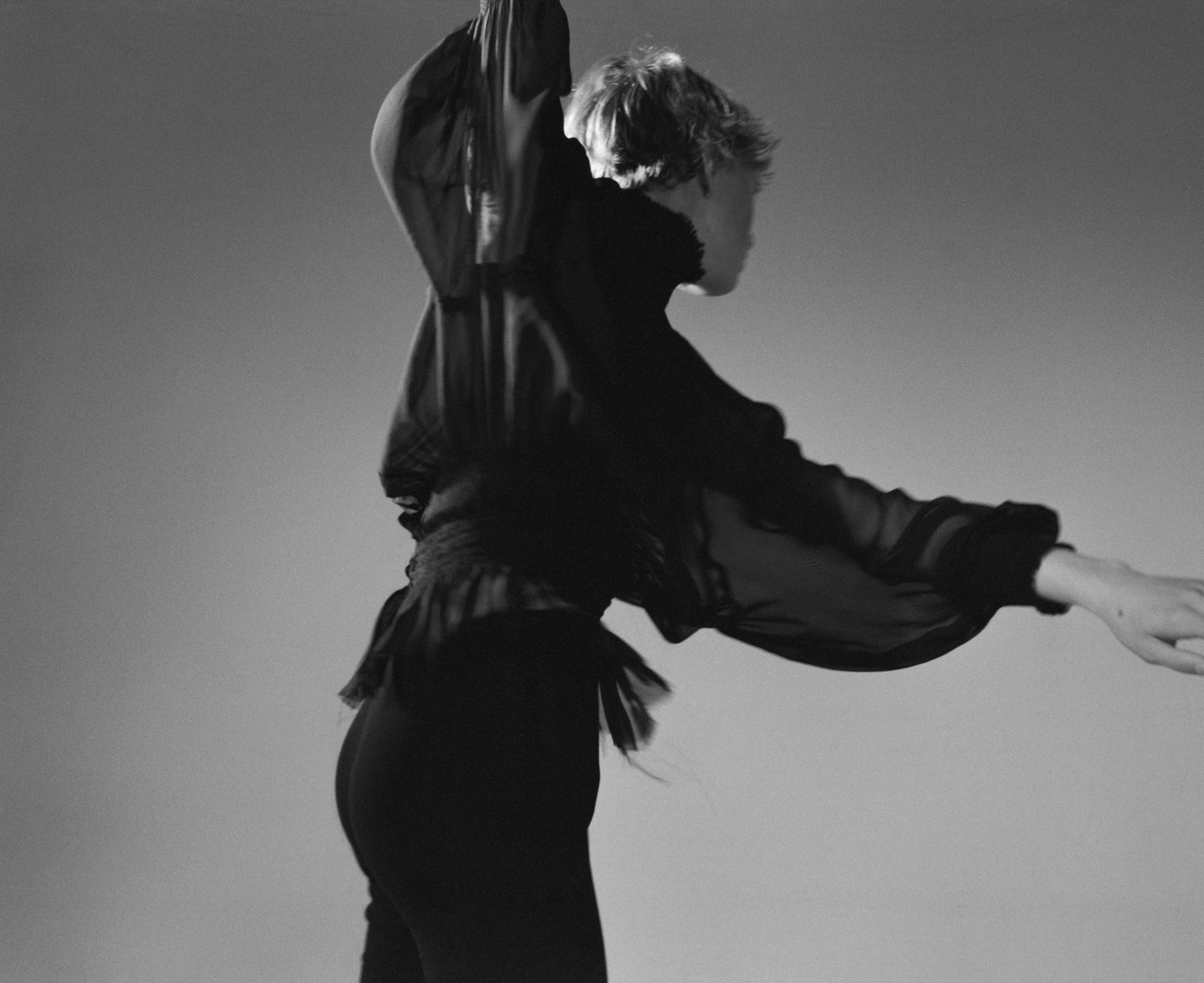 Top by ANN DEMEULEMEESTER, bodysuit by CHANEL.