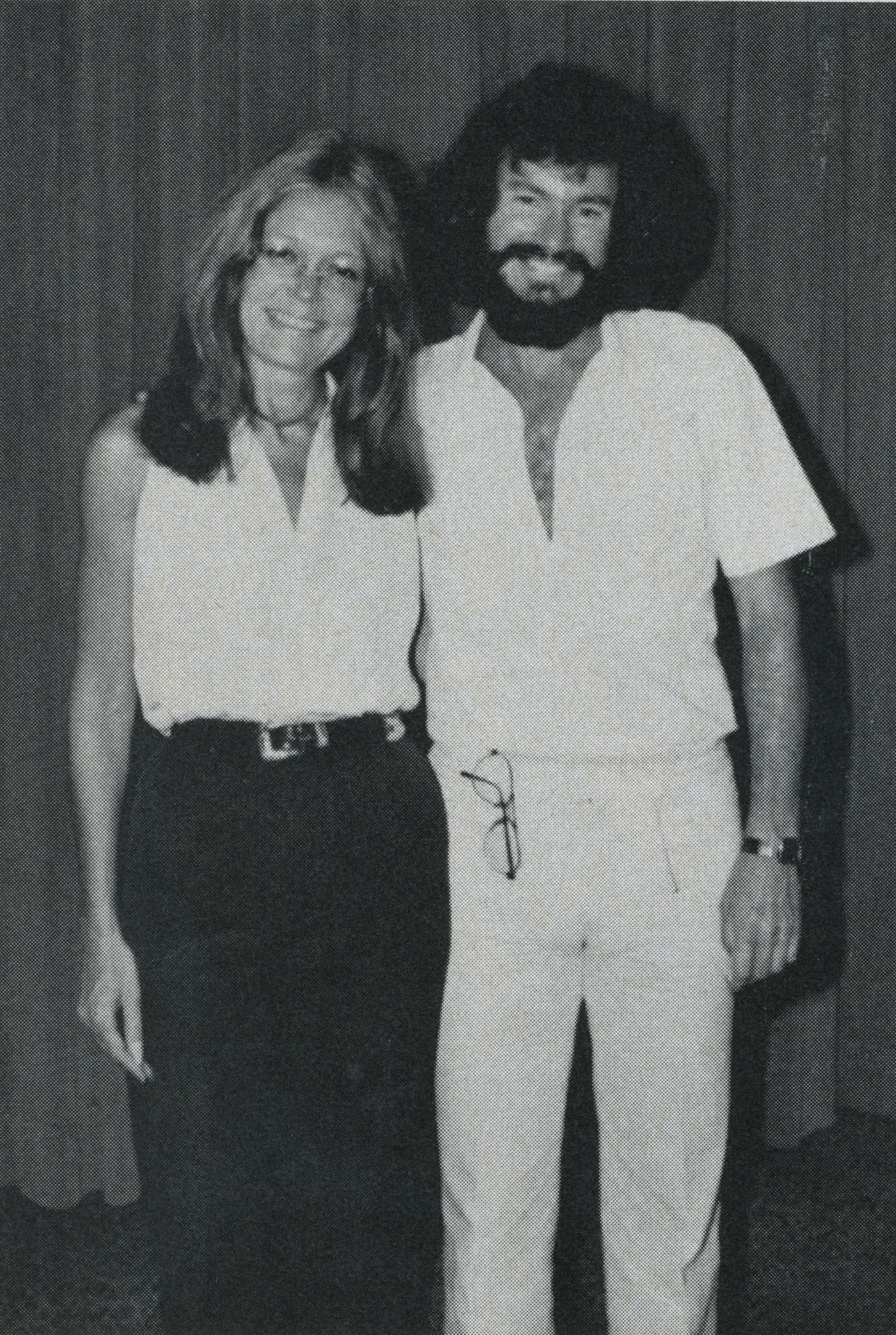 Gloria Steinem standing and smiling next to Warren Farrell