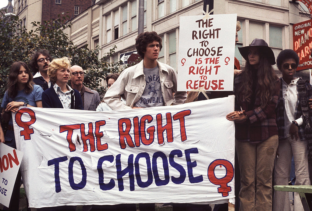 Pro-choice demonstrators hold up a banner that reads