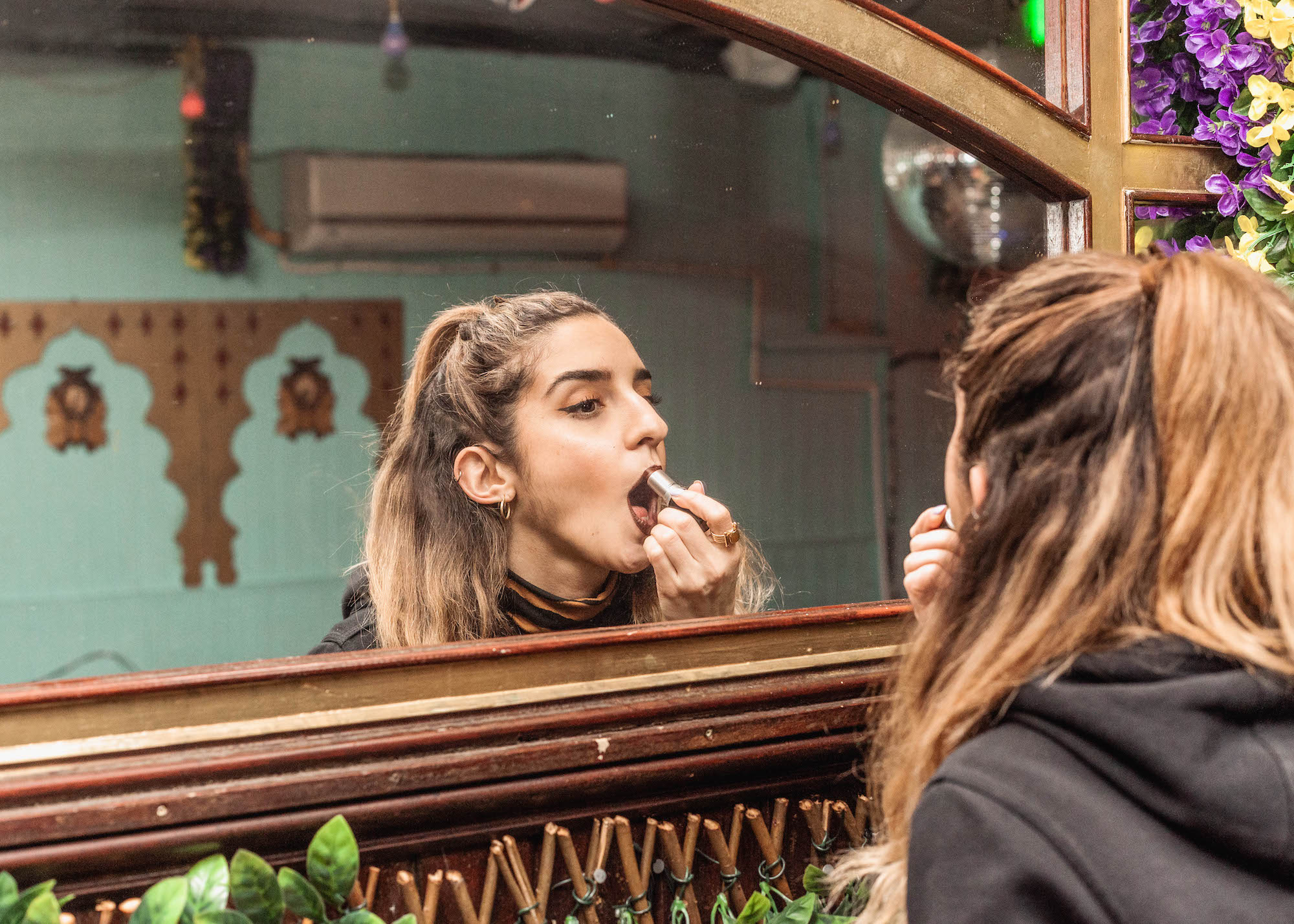woman applying lipstick