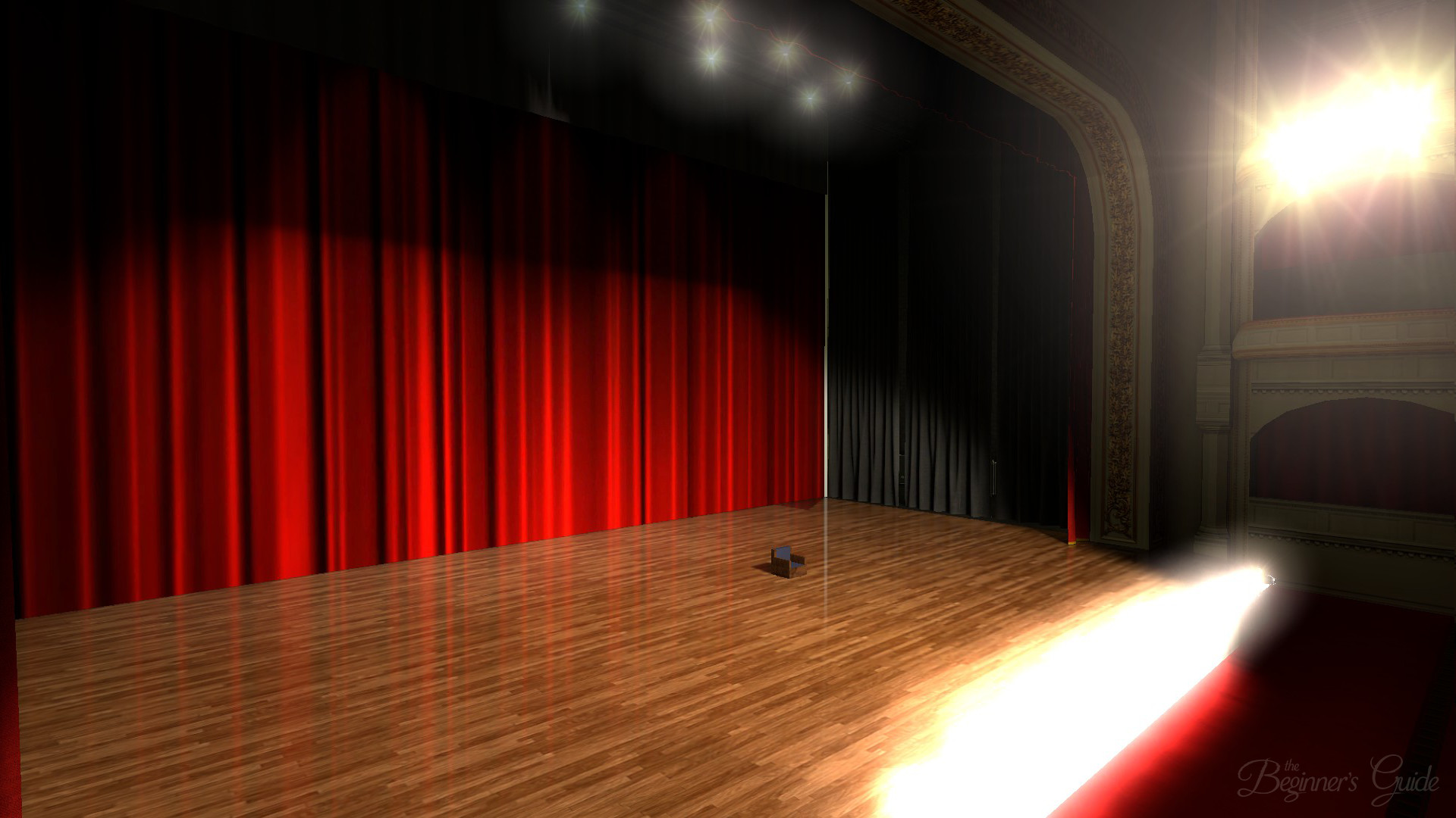 A bare theater stage lit by footlights in 'The Beginner's Guide' a scene which neatly encompasses its fourth-wall breaking themes.