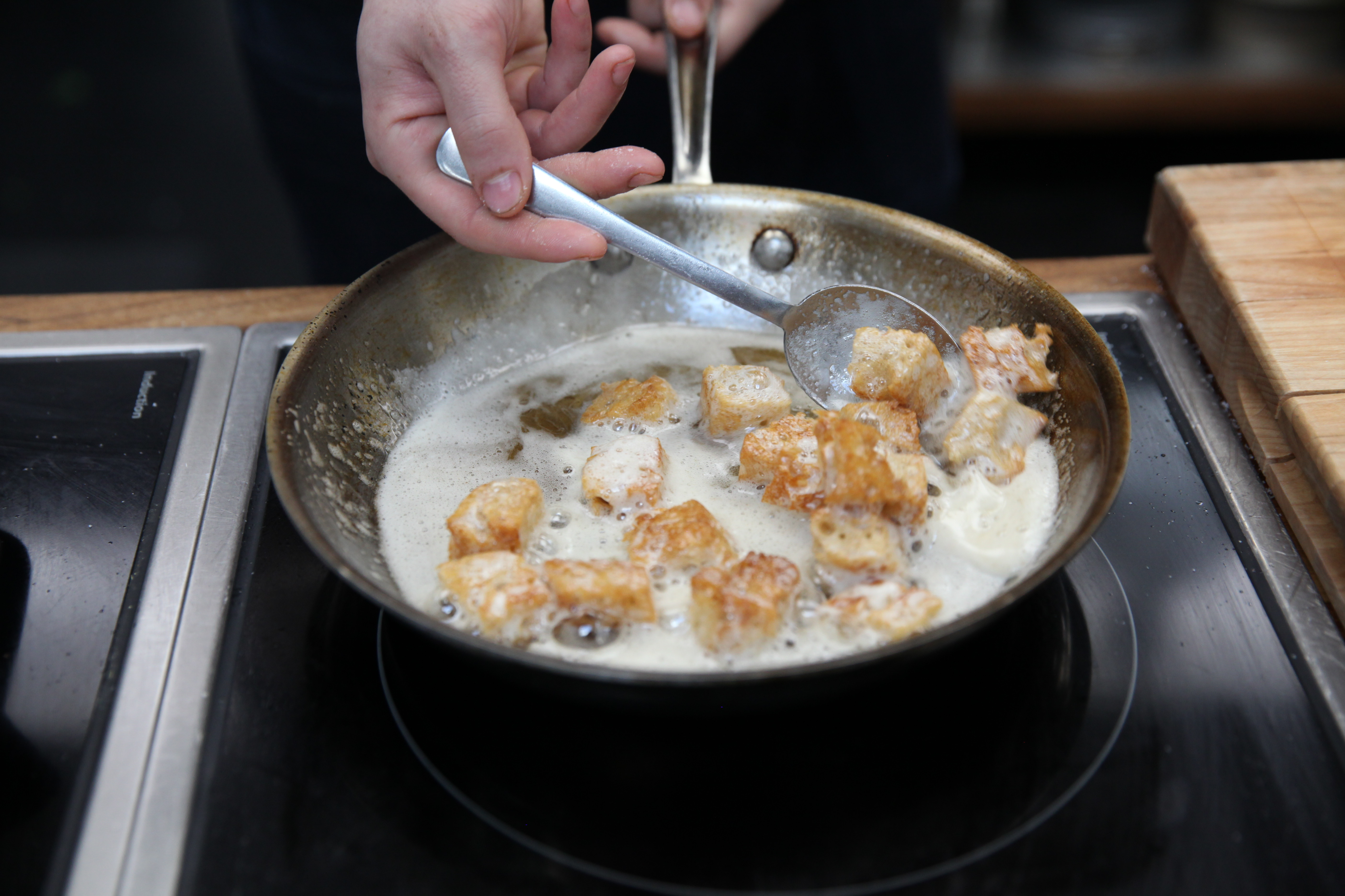 croutons cooking in butter and oil