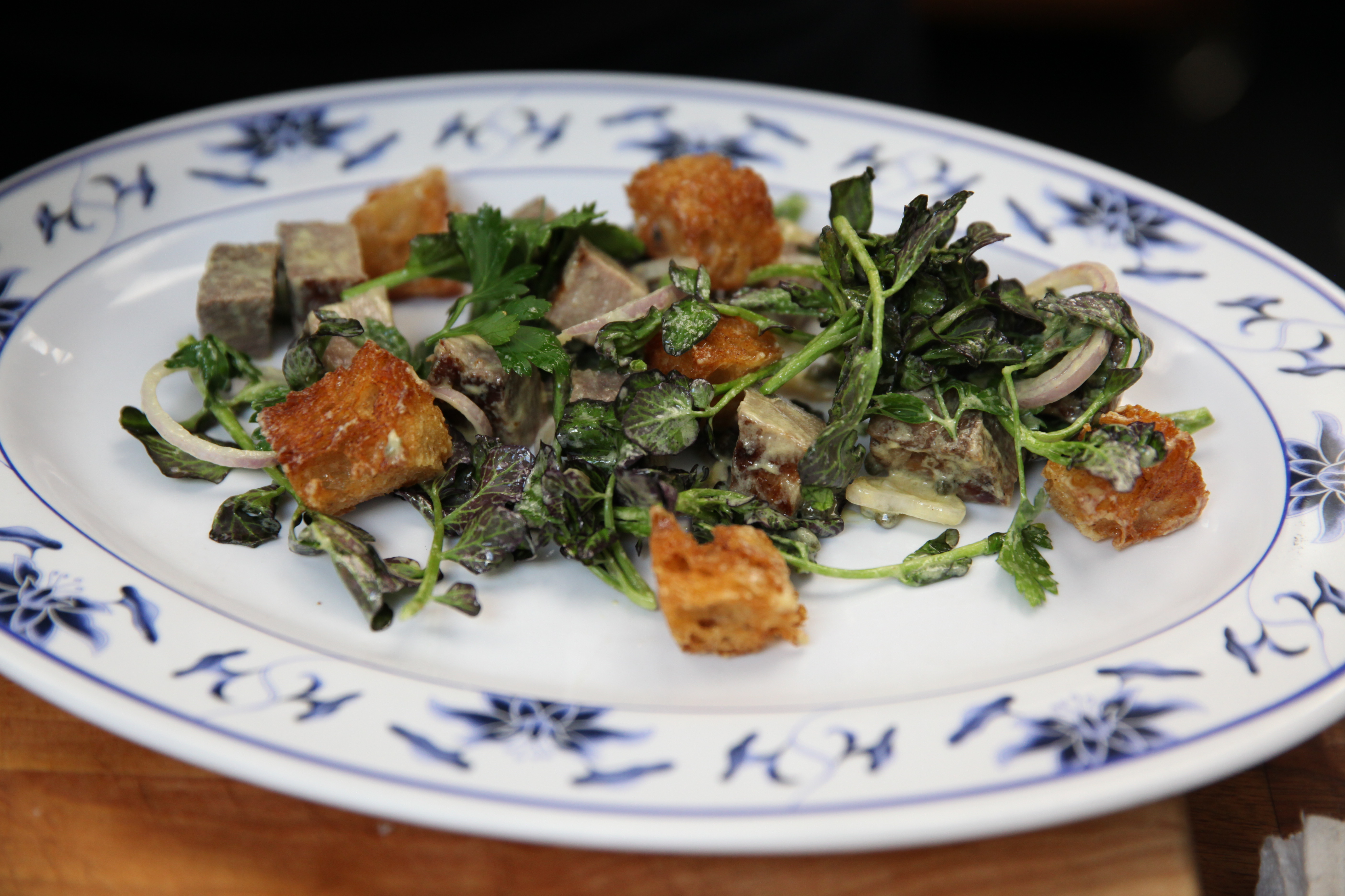 grilled beef tongue salad with croutons and watercress