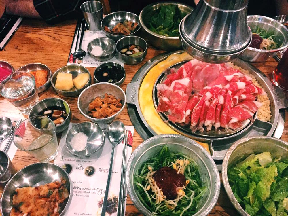 a spread of korean barbecue at Kang Ho Dong Baekjeong