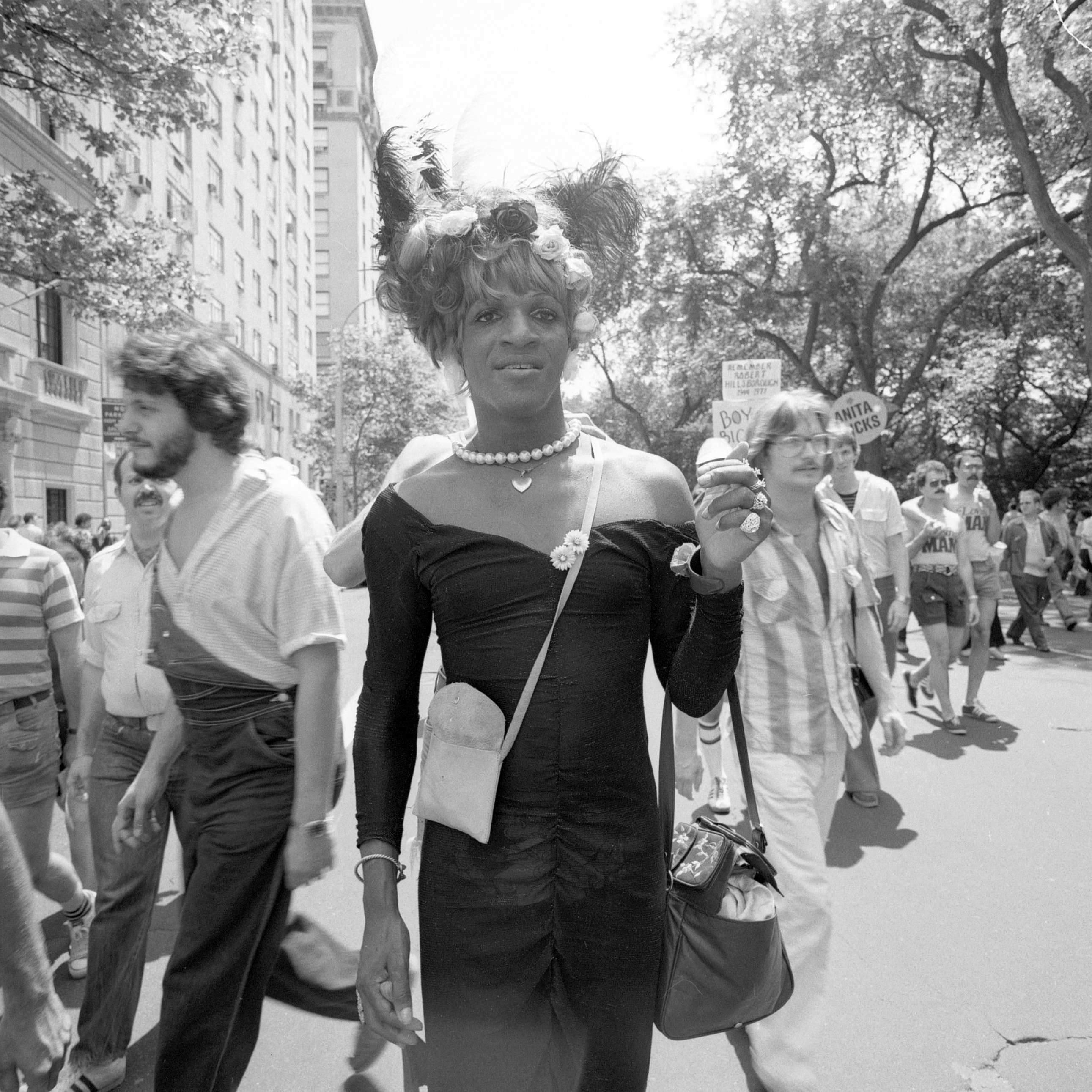 1561495007198-1977_06_PrideMarchNYC_blackDress