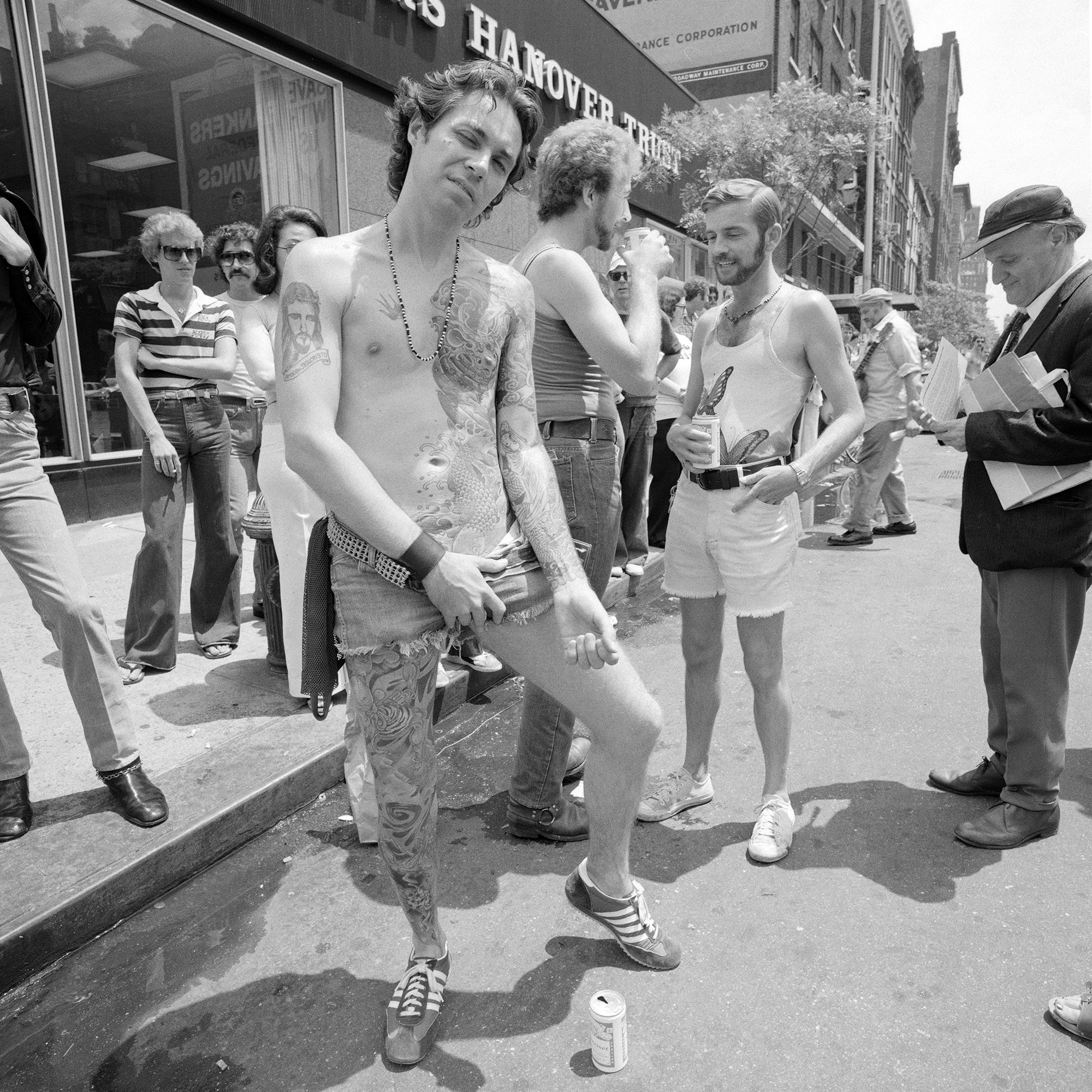 1561495442703-1977_06_NYC_GayPride_tattoo_hanover_trust_2000px