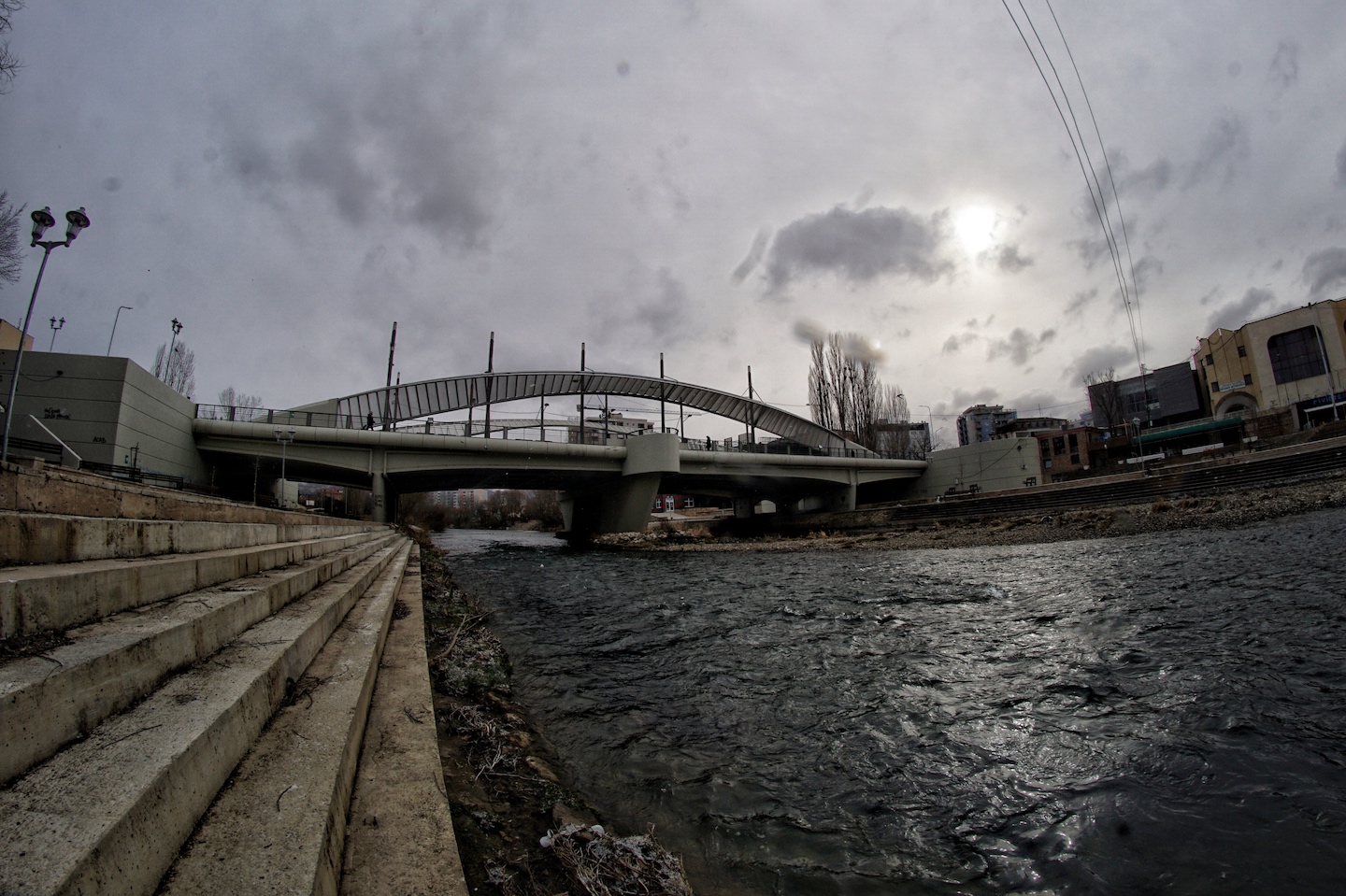 1562778590245-A-view-of-the-main-bridge-where-most-incidents-take-place-from-the-bank-of-Ibar-river-The-bridge-is-under-24h-protection-by-Kfor-or-Kosovo-police