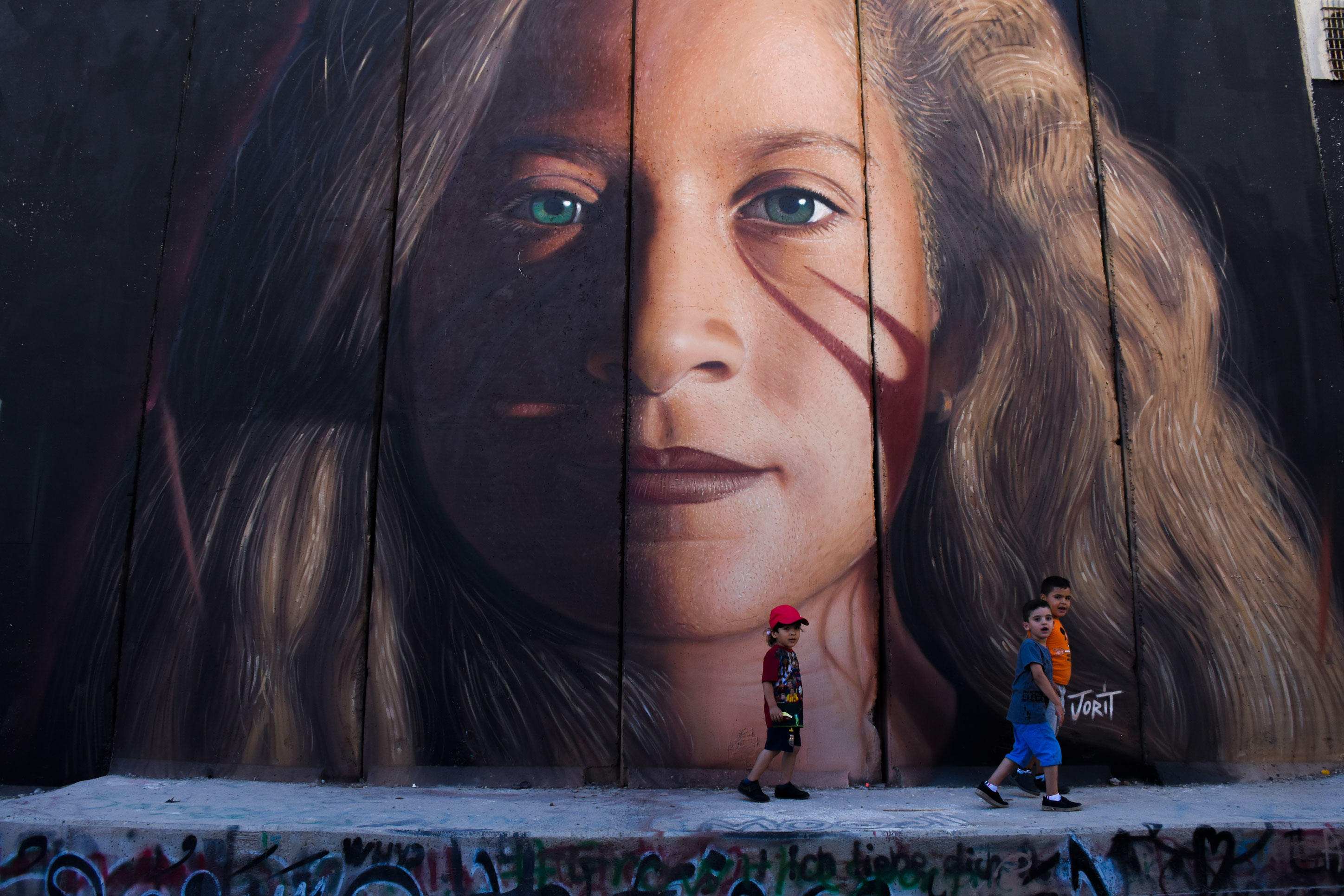 1564670701708-Ahed-Tamimi-dipinta-sul-muro-di-Apartheid-dallartista-italiano-Jorit-Betlemme
