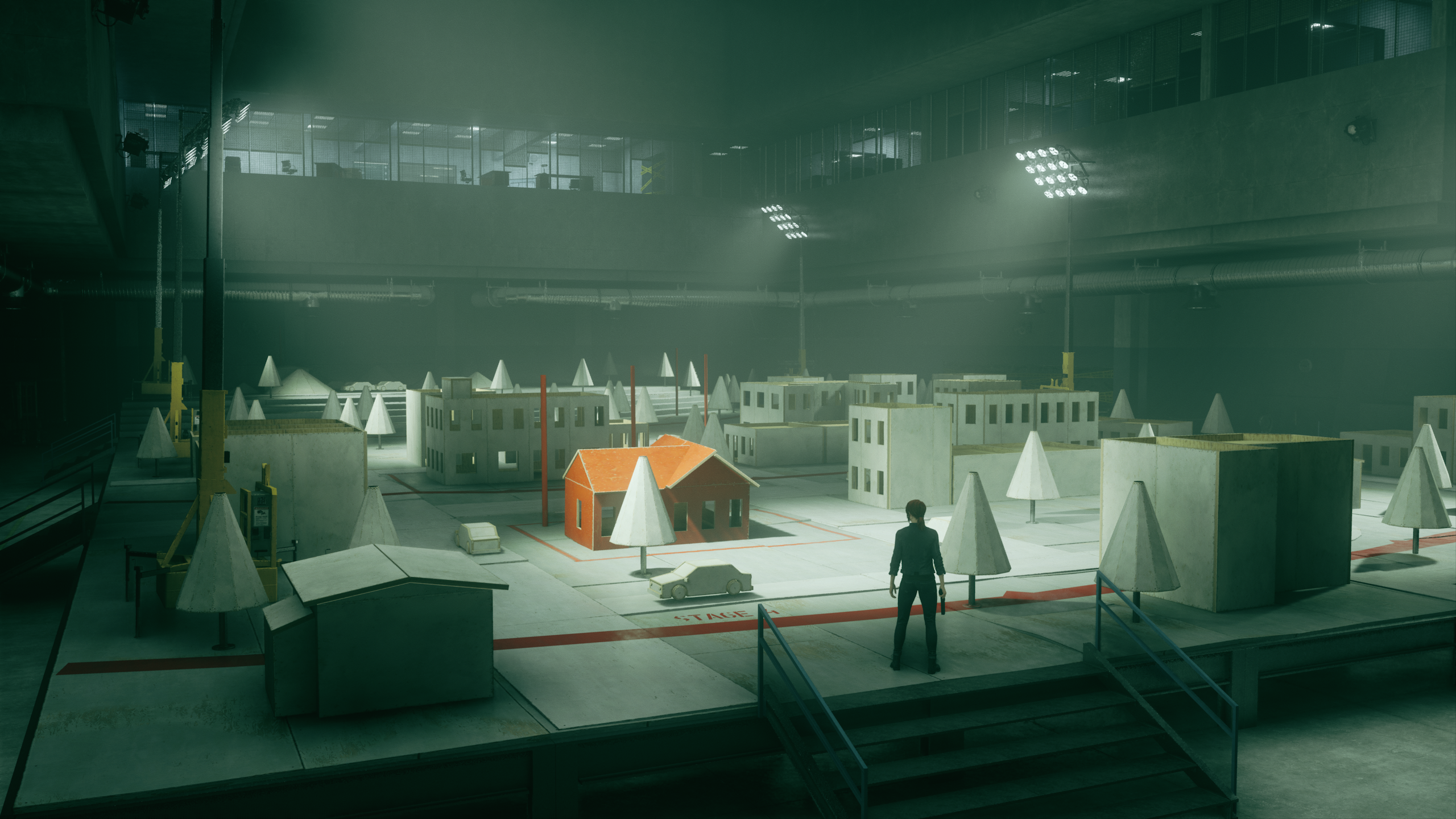 A soundstage in Remedy Entertainment's Control where a young woman contemplates a re-creation of her childhood hometown.