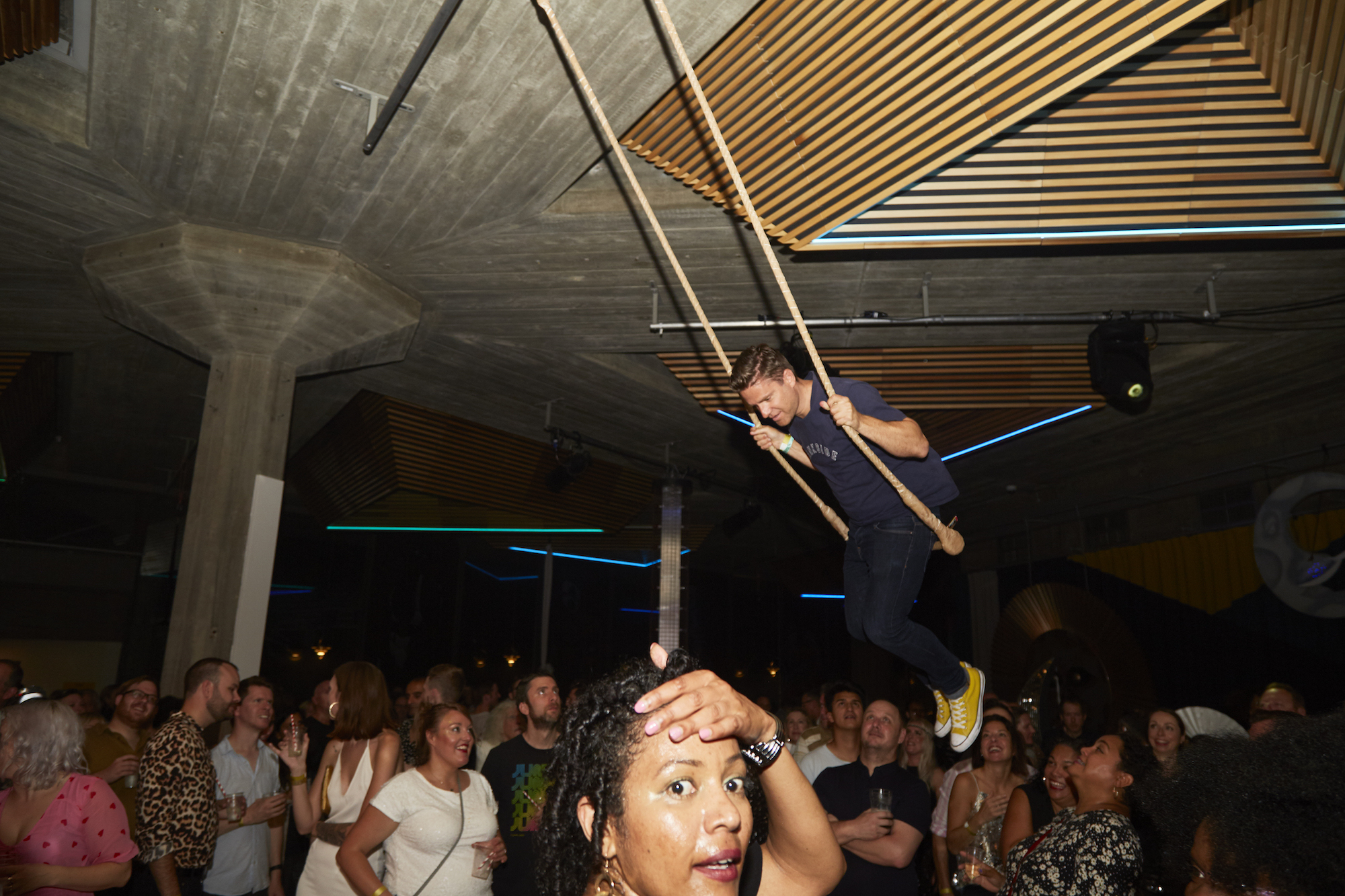 man swinging inside