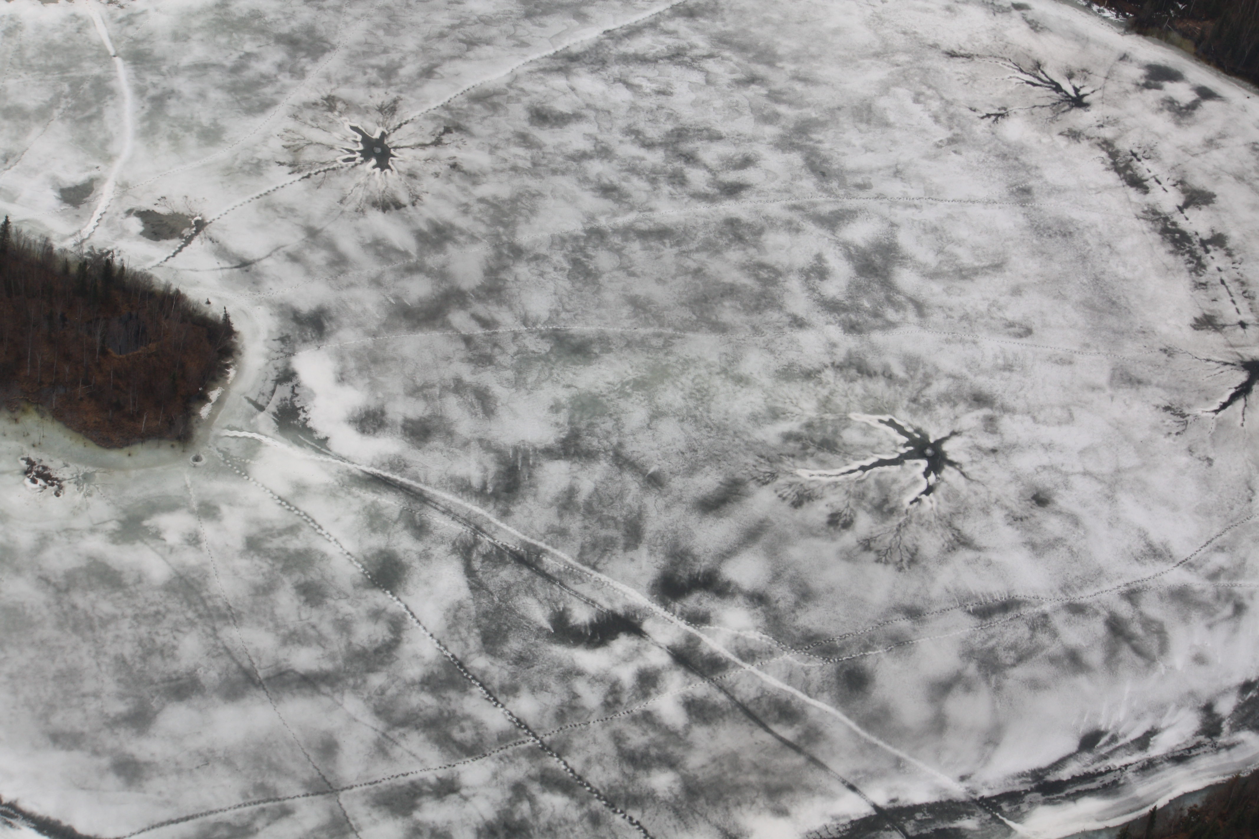 A flyover a lake in Old Crow in May revealed visible holes in the ice.