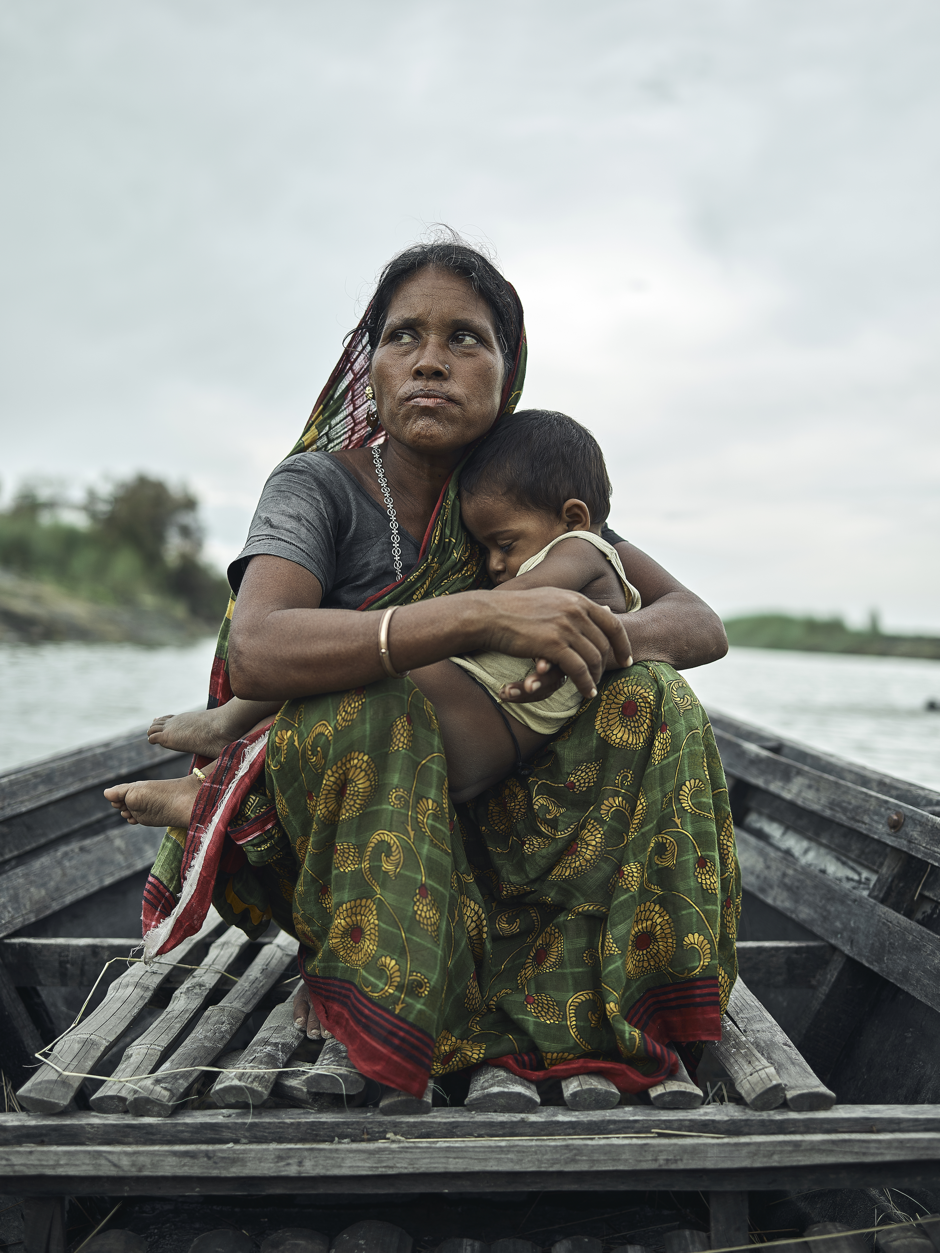 Firoza Khatun’s husband abandoned her family after their char eroded decades ago. Since then, she has raised her children alone, and continued to pay taxes on the submerged land in hope that it may emerge and she can pass it on to her children. “My heart won’t let me leave this place.”