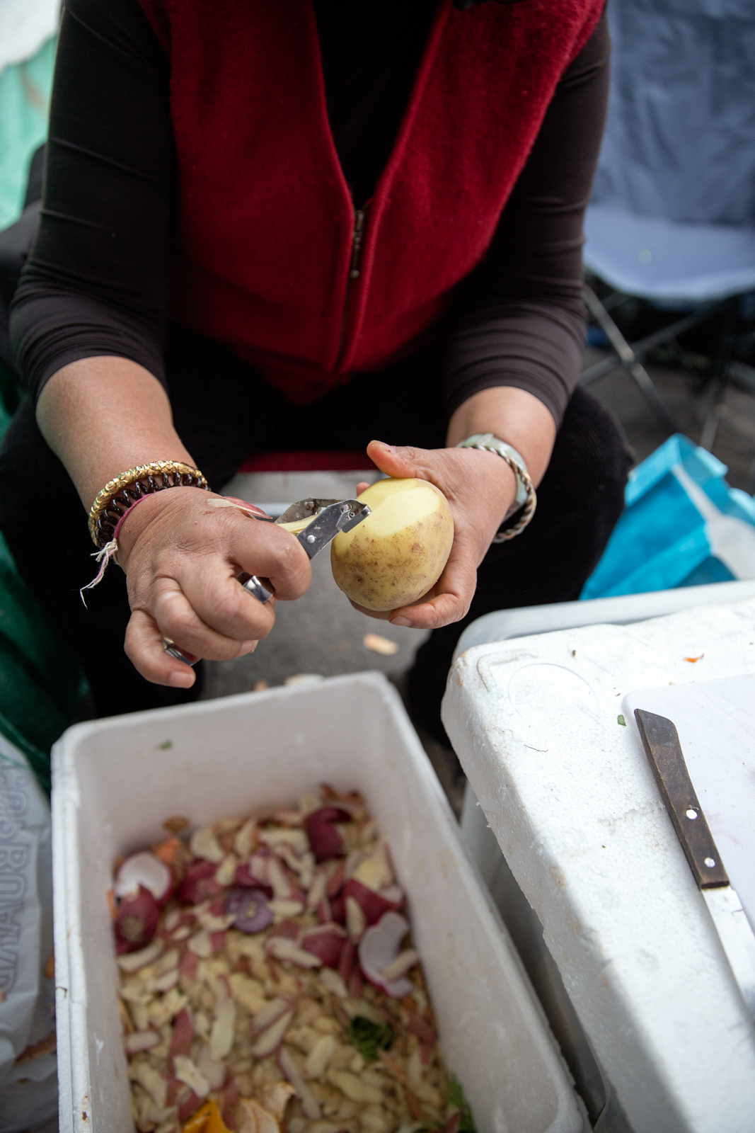 Extinction Rebellion volunteers preparing food in kitchen on London protest