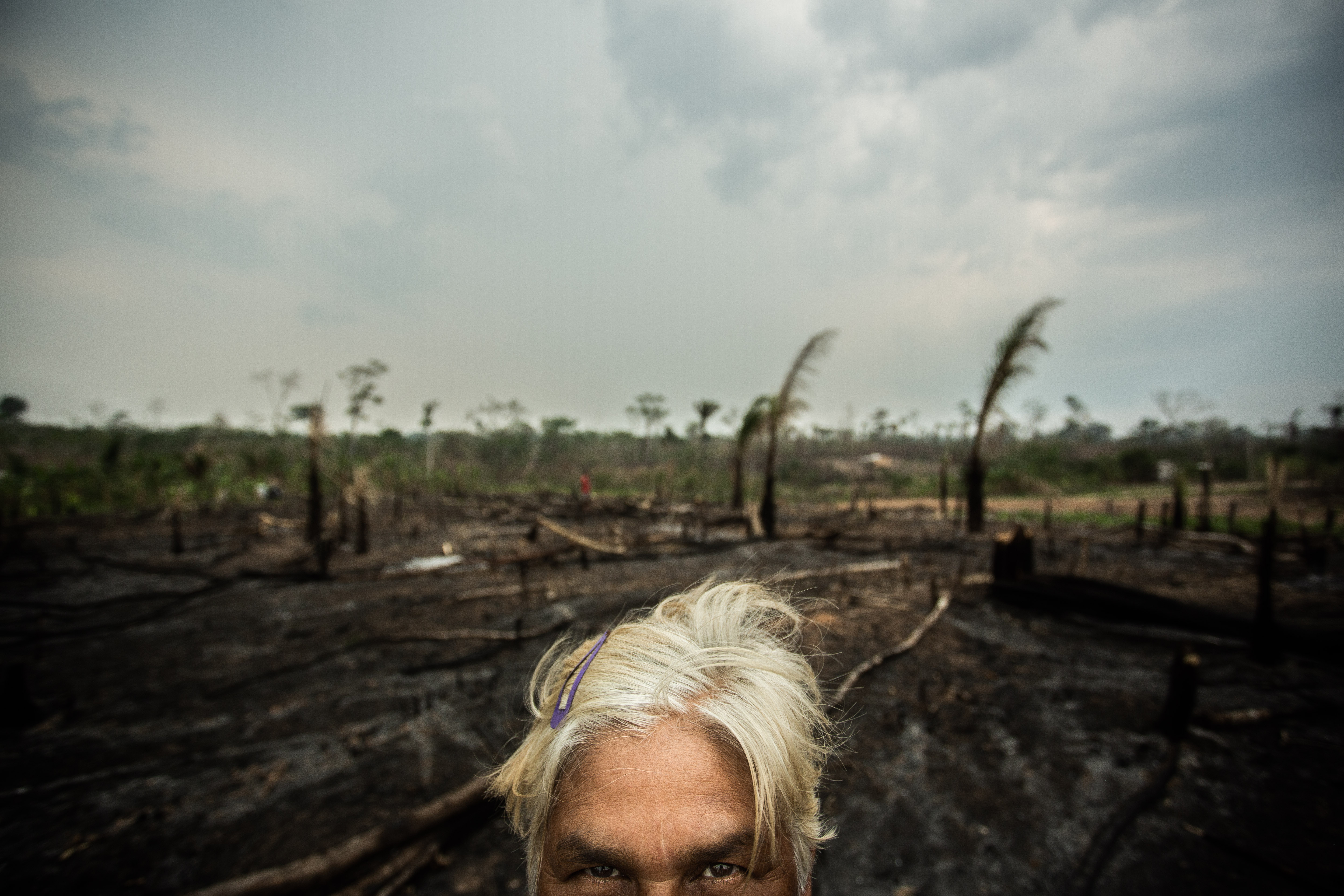 Dona Jô in front of her devastated land